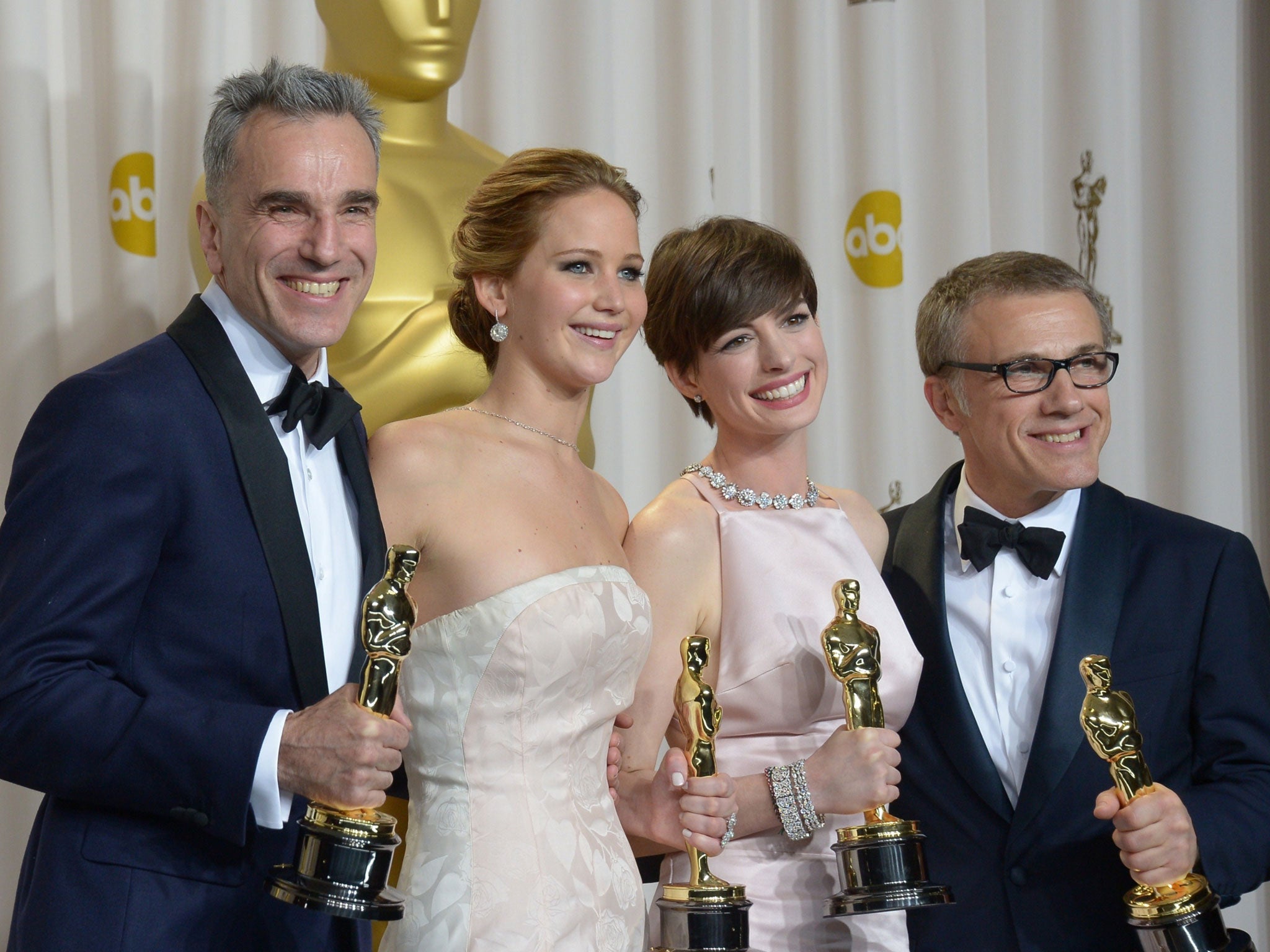 Daniel Day-Lewis, Jennifer Lawrence, Anne Hathaway, and Christoph Waltz at the 2013 Oscars - the four winners will be presenting awards on Sunday