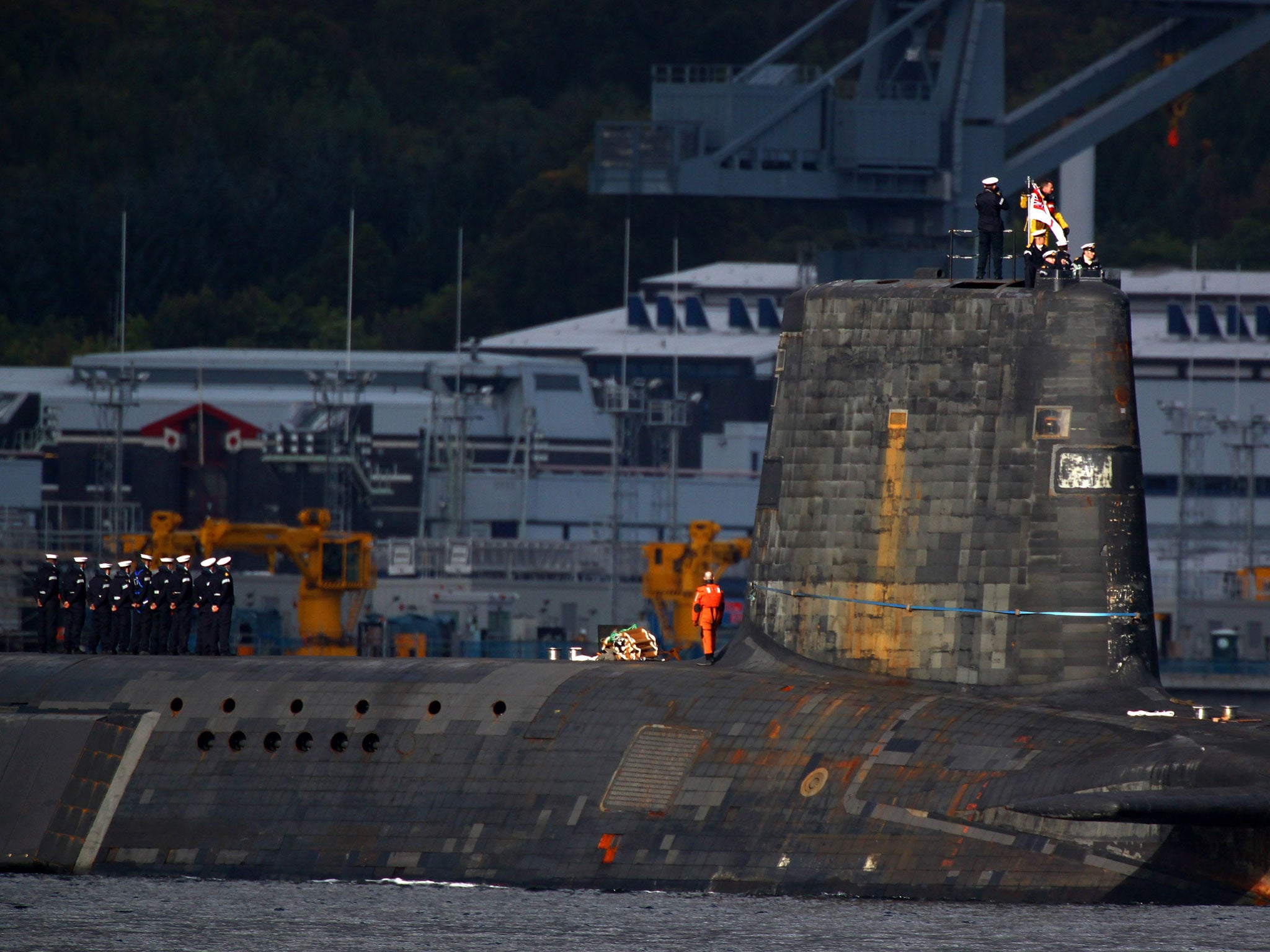 A trident submarine makes it's way out from Faslane Naval base on September 23, 2009 in Faslane, Scotland.