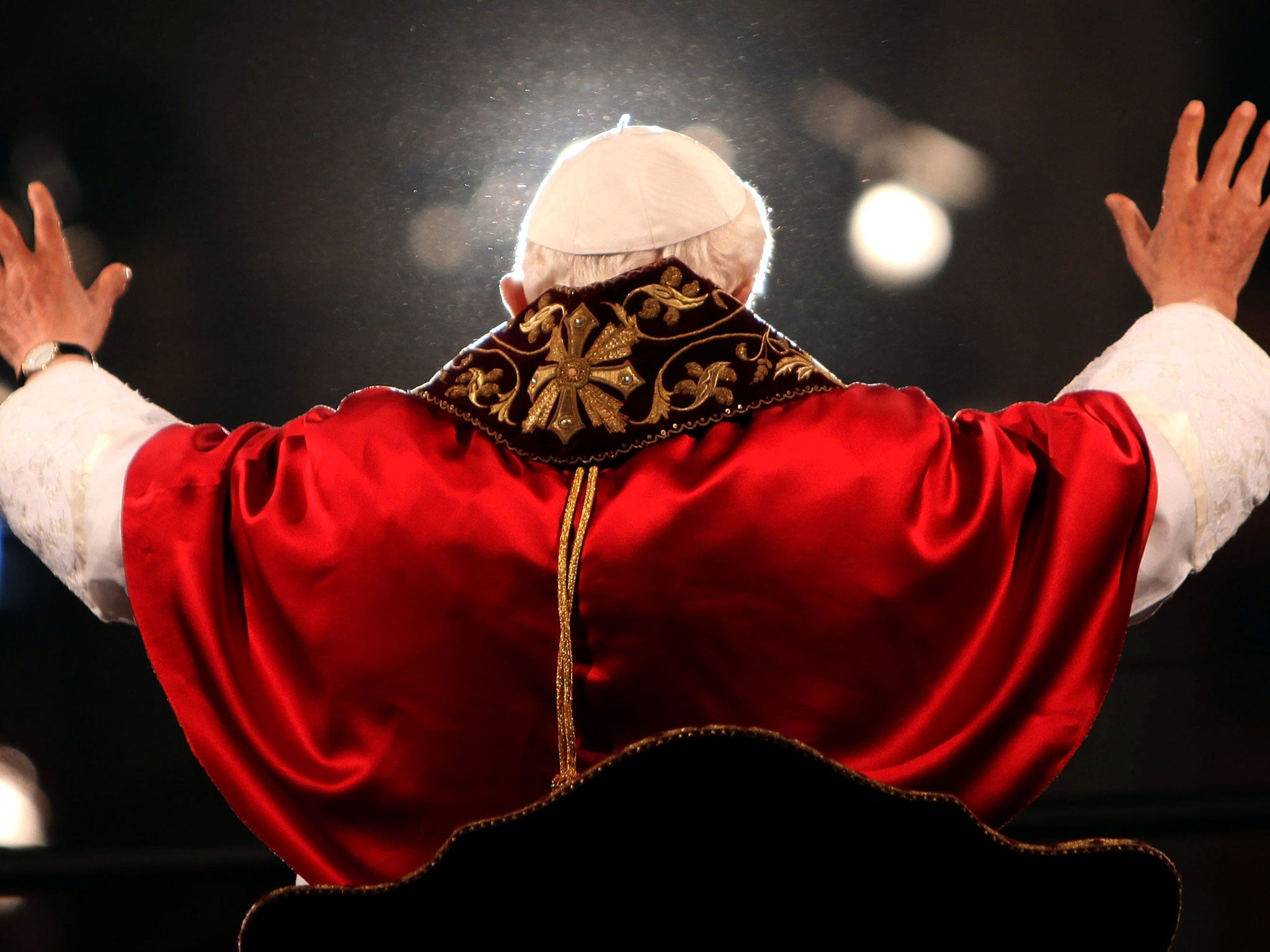 Pope Benedict XVI waves to the faithful gathered at the Colosseum during the Way Of The Cross procession on Good Friday April 6, 2012 in Rome, Italy.