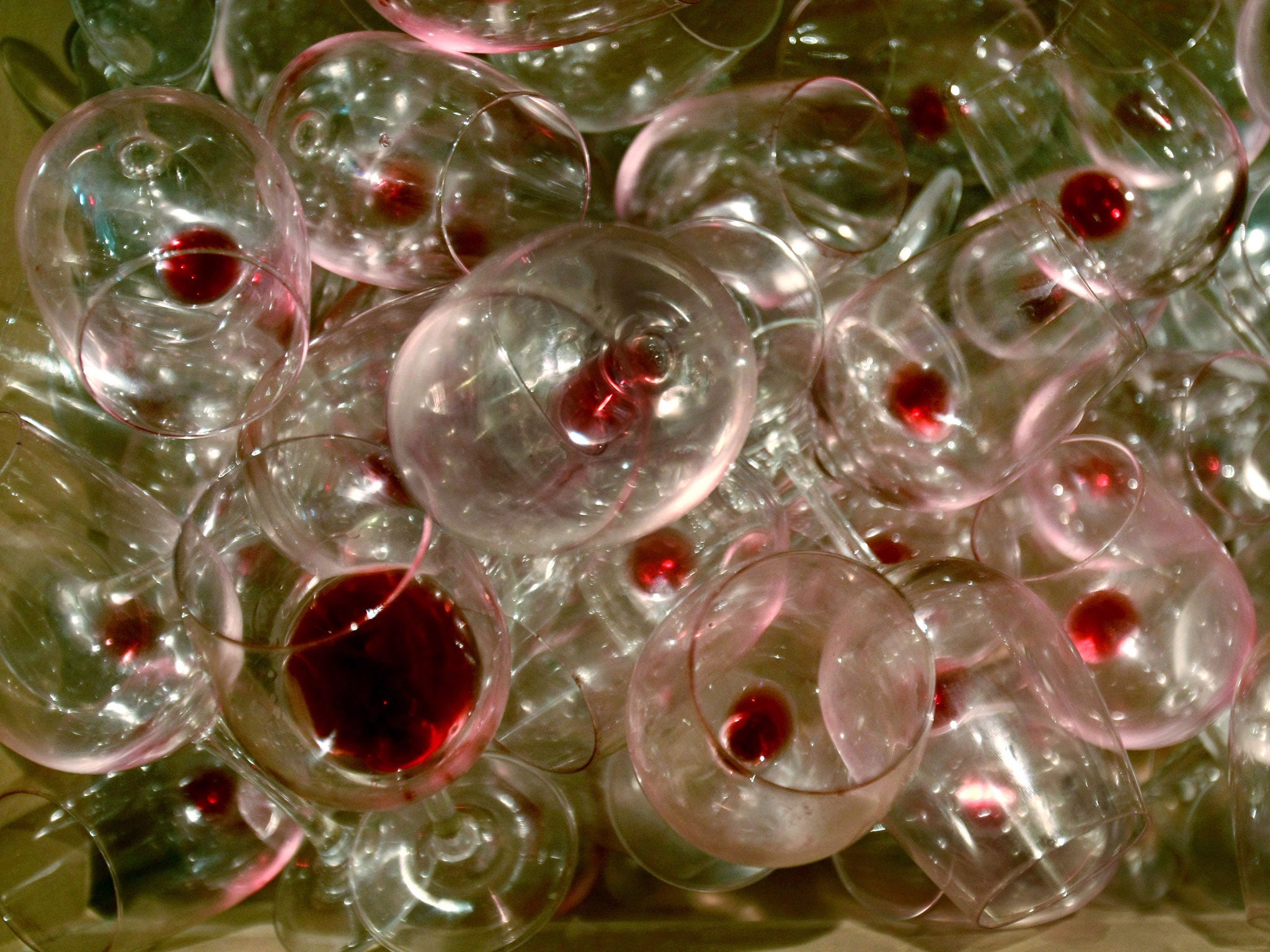 Dirty wine glasses pile up as Israelis leave a tasting of local and foreign wines at the Sommelier 2008 festival November 18, 2008 in Tel Aviv, Israel.