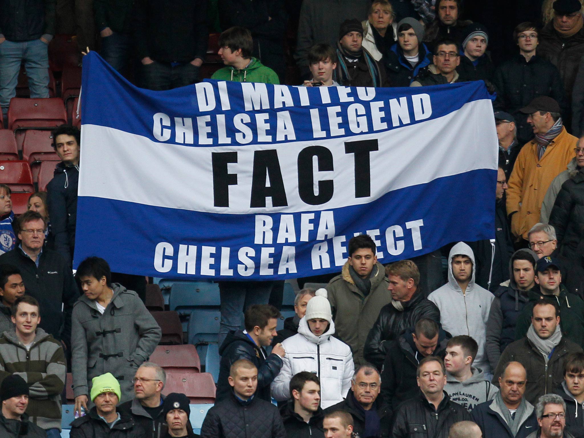 A banner is held up by Chelsea fans