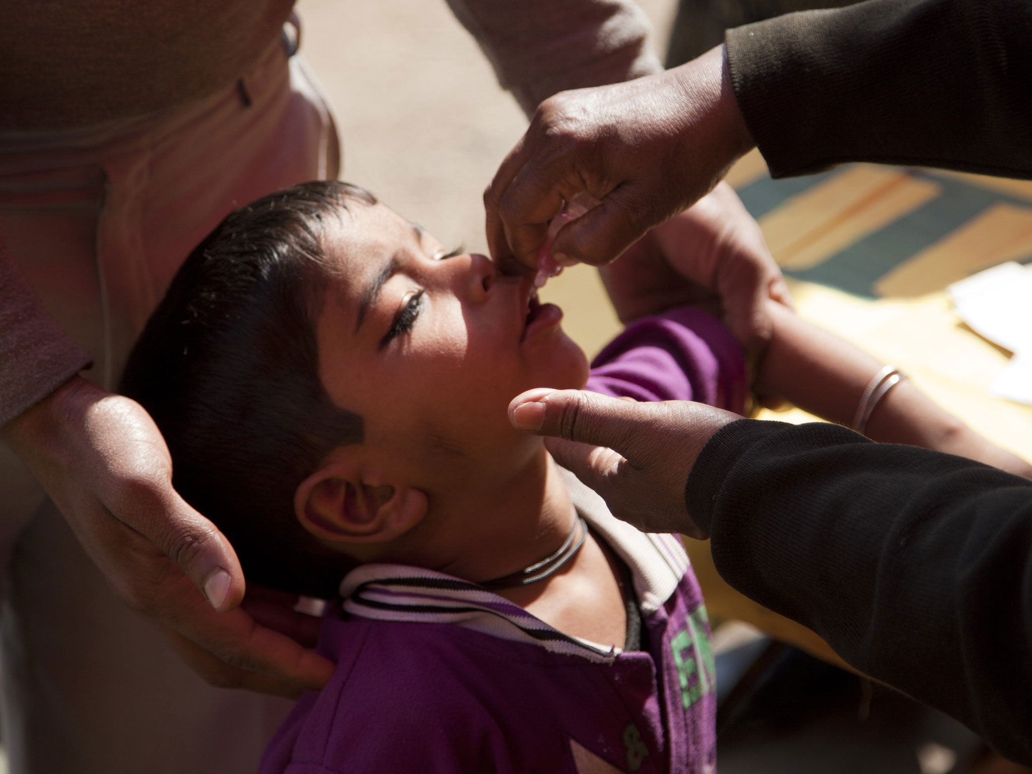 On a dirty Delhi street, two drops of pink liquid are squeezed into a child’s mouth, and the world comes a step closer to an extraordinary victory that is now within our grasp