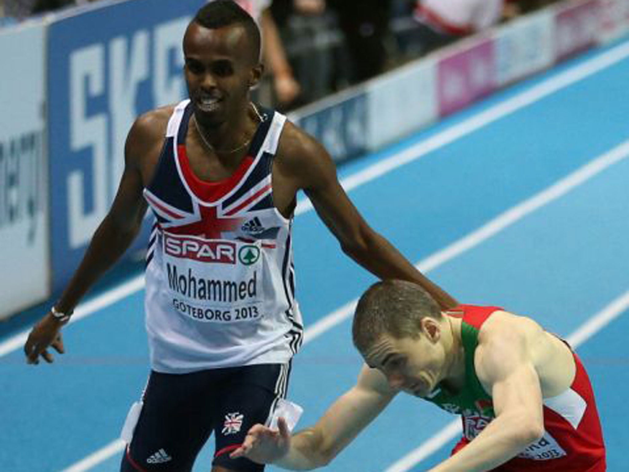 Mukhtar Mohammed (left) crosses the line ahead Belarus’s Anis Ananenka to win the bronze