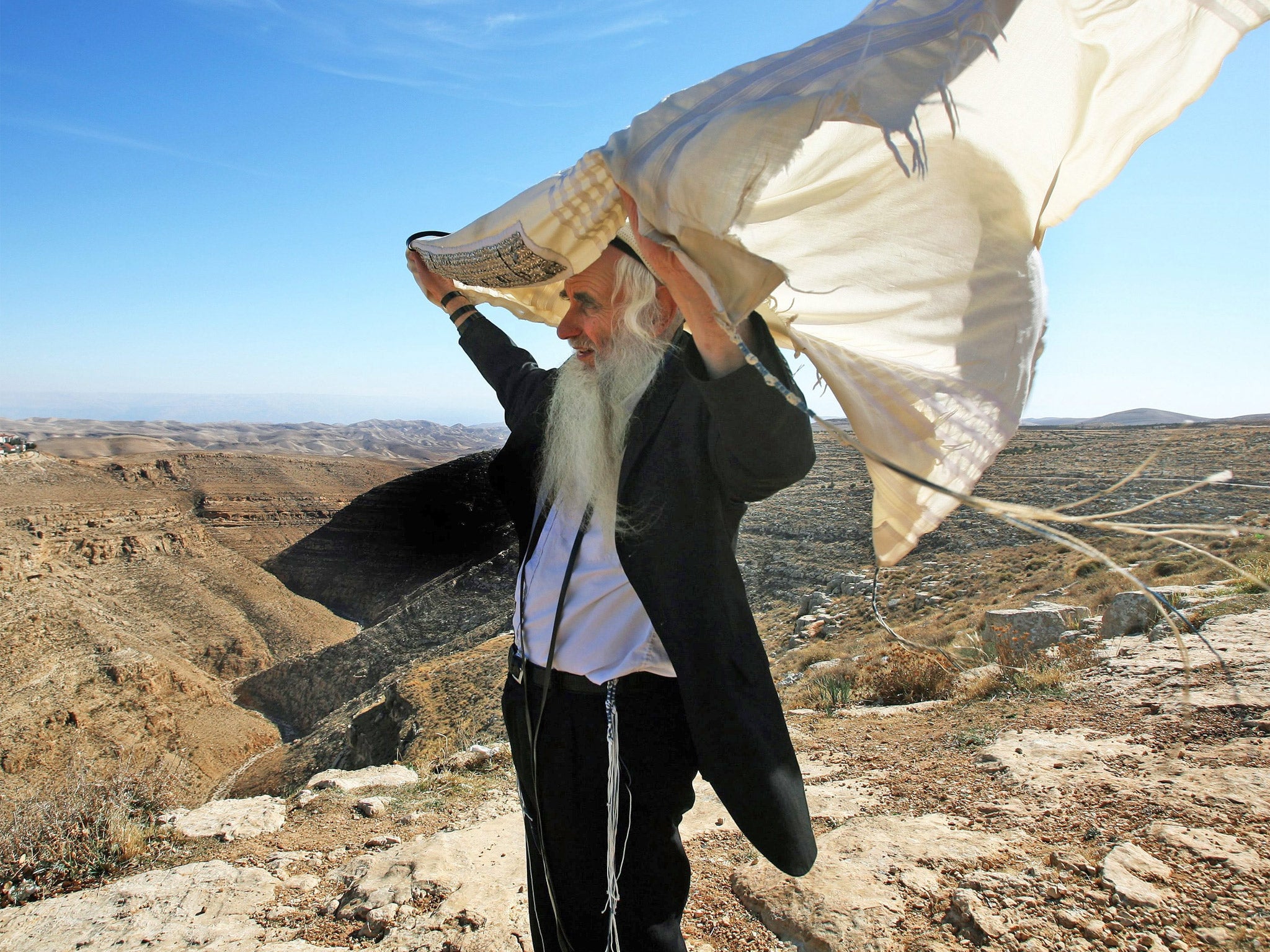 Rabbi Froman with his peace shawl caught in the wind