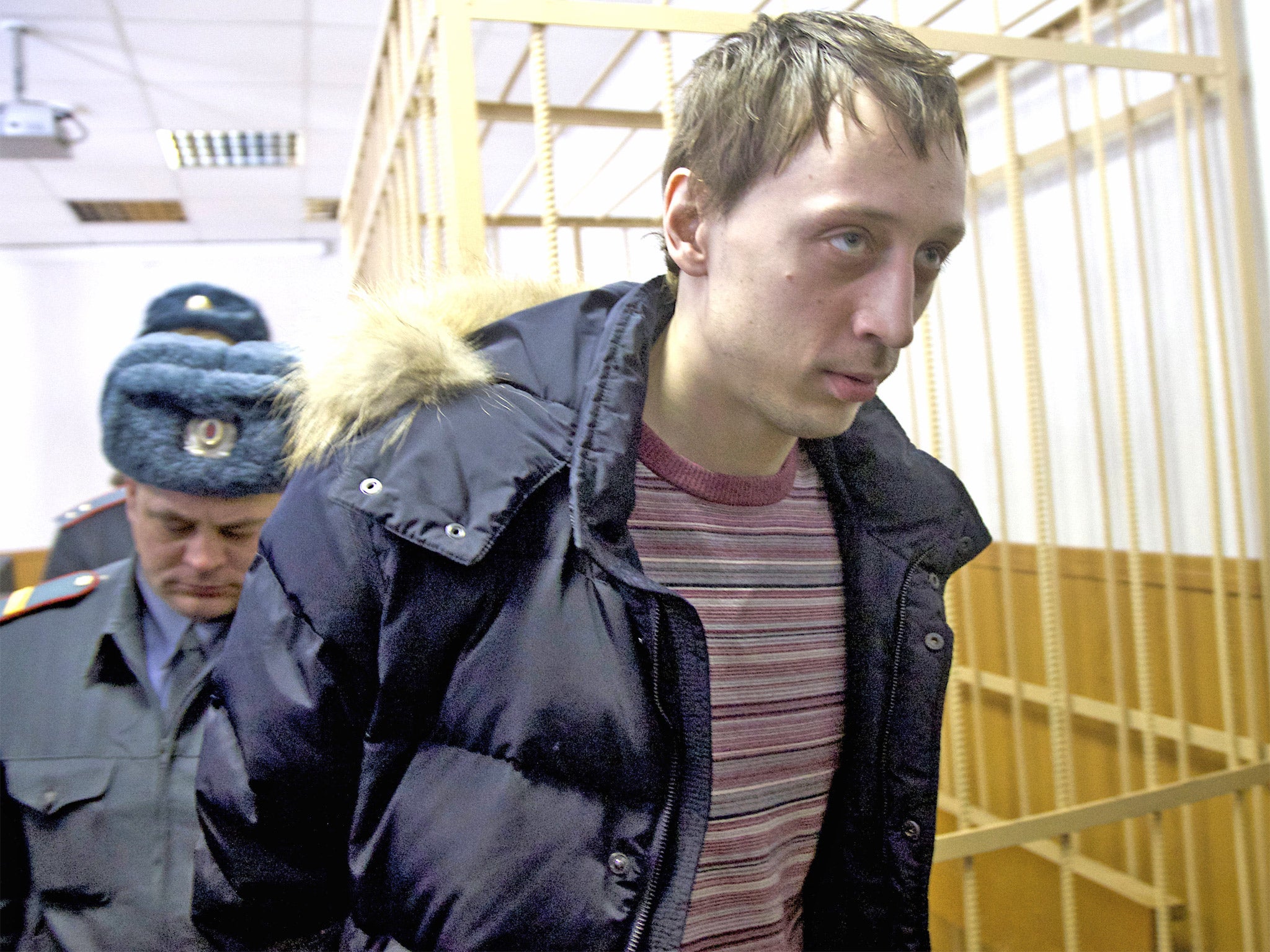 Pavel Dmitrichenko is led into court