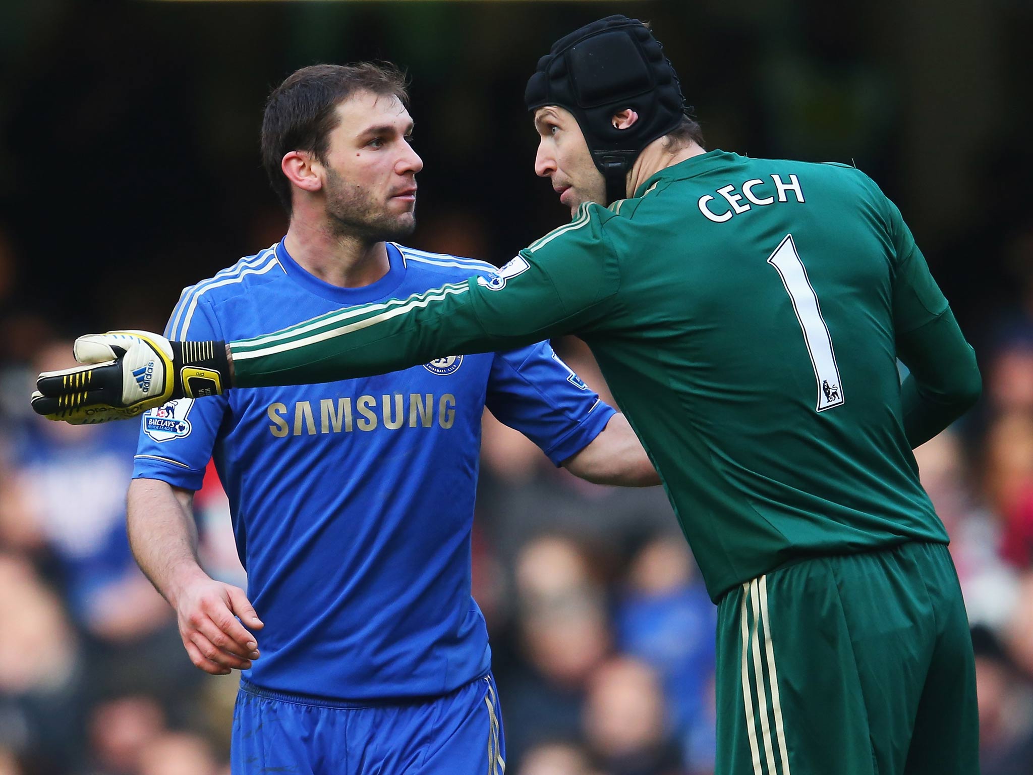 Branislav Ivanovic of Chelsea talks to goalkeeper Petr Cech