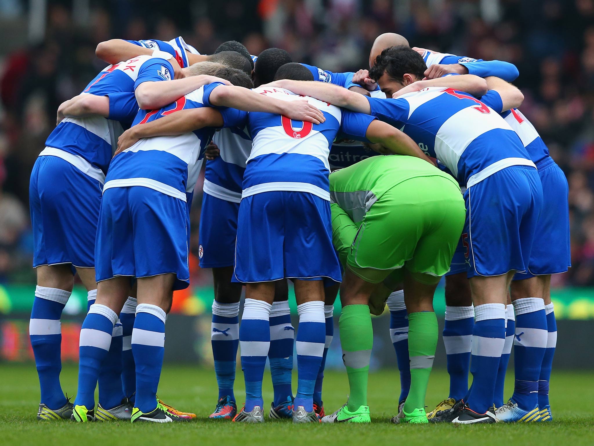 Reading's players huddle together