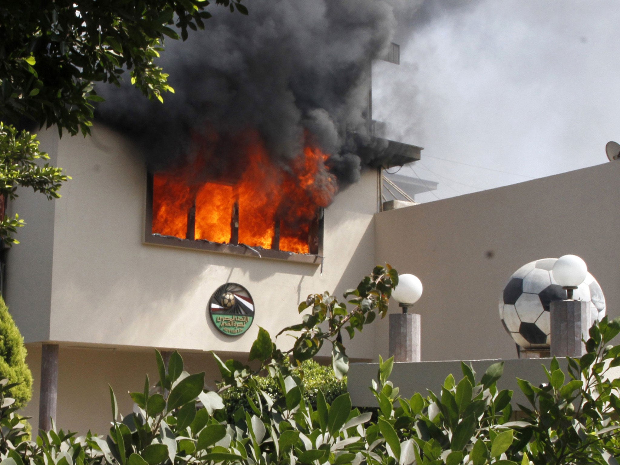 Flames rise from a room at the headquarters of the Egyptian Football Association in Cairo