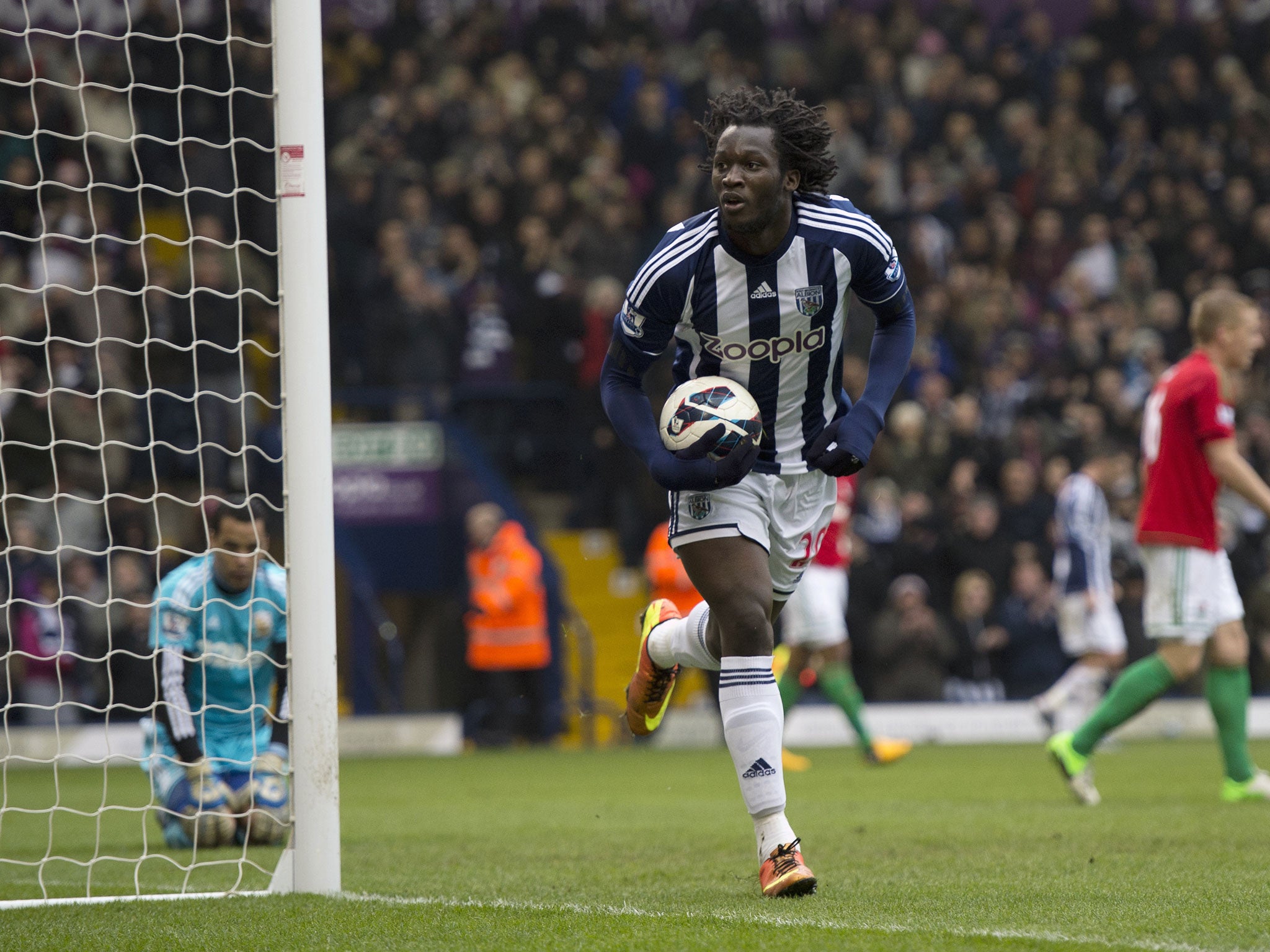 West Bromwich Albion's Belgian striker Romelu Lukaku (C) runs to celebrate after scoring