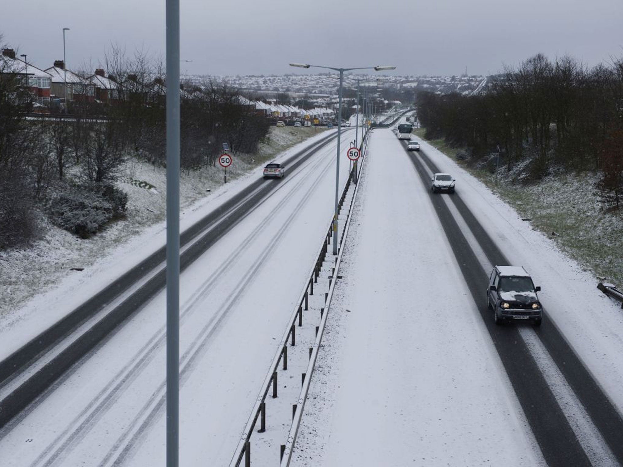 The A69 in Newcastle after more overnight snow, as a return of freezing temperatures and snow this morning will further delay springtime weather for Britain.