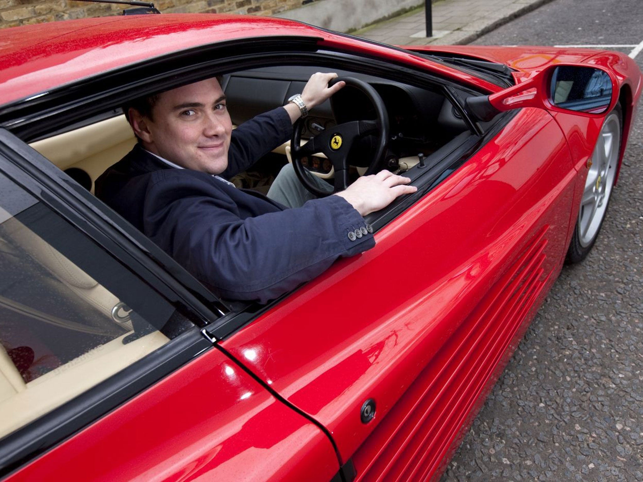 The Independent’s Jamie Merrill tries out the red Ferrari that once belonged to Sir Elton John