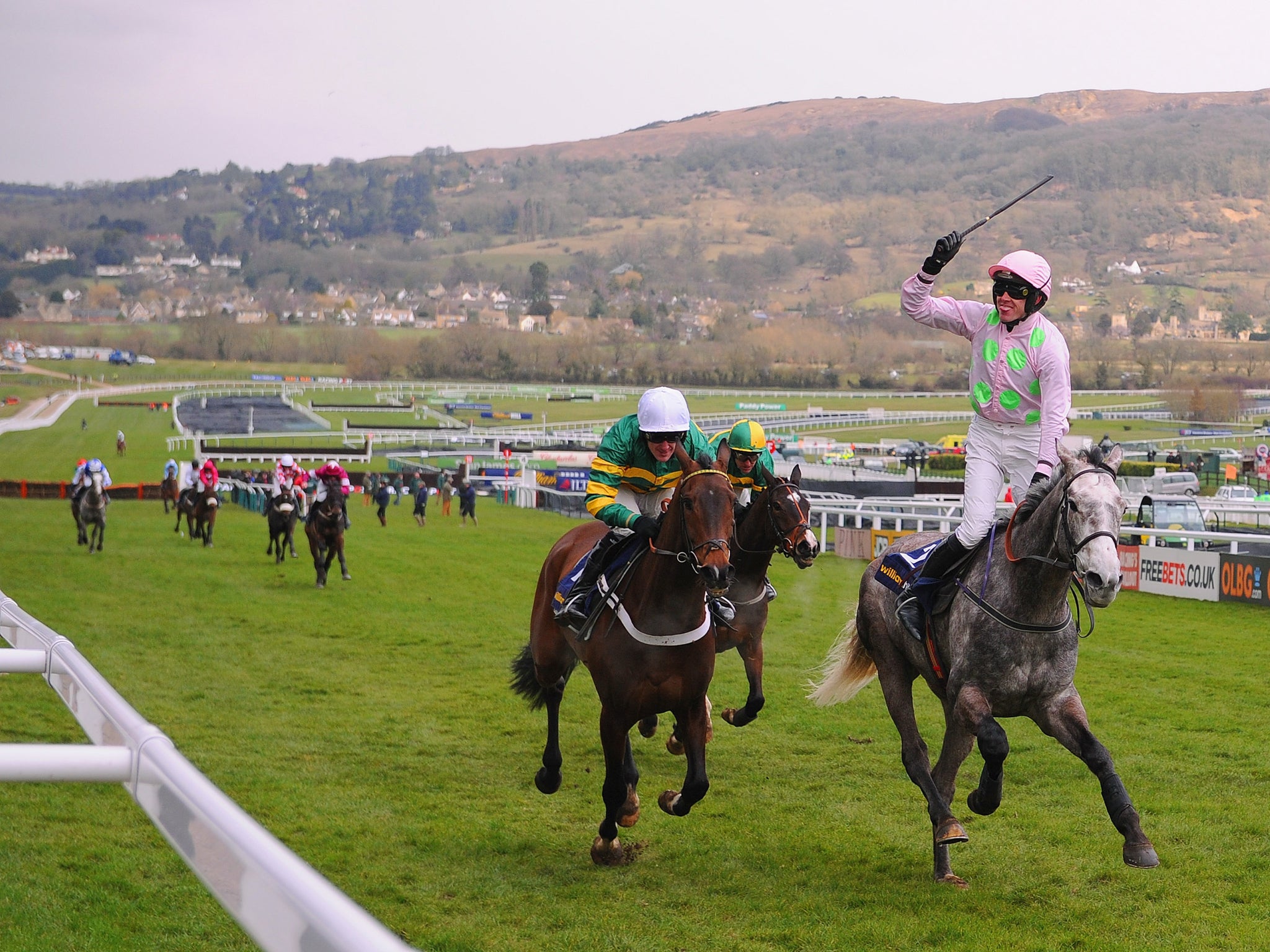 Ruby Walsh celebrates winning The William Hill Supreme Novices' Hurdle Race on Champagne Fever during Champion Day at Cheltenham Racecourse