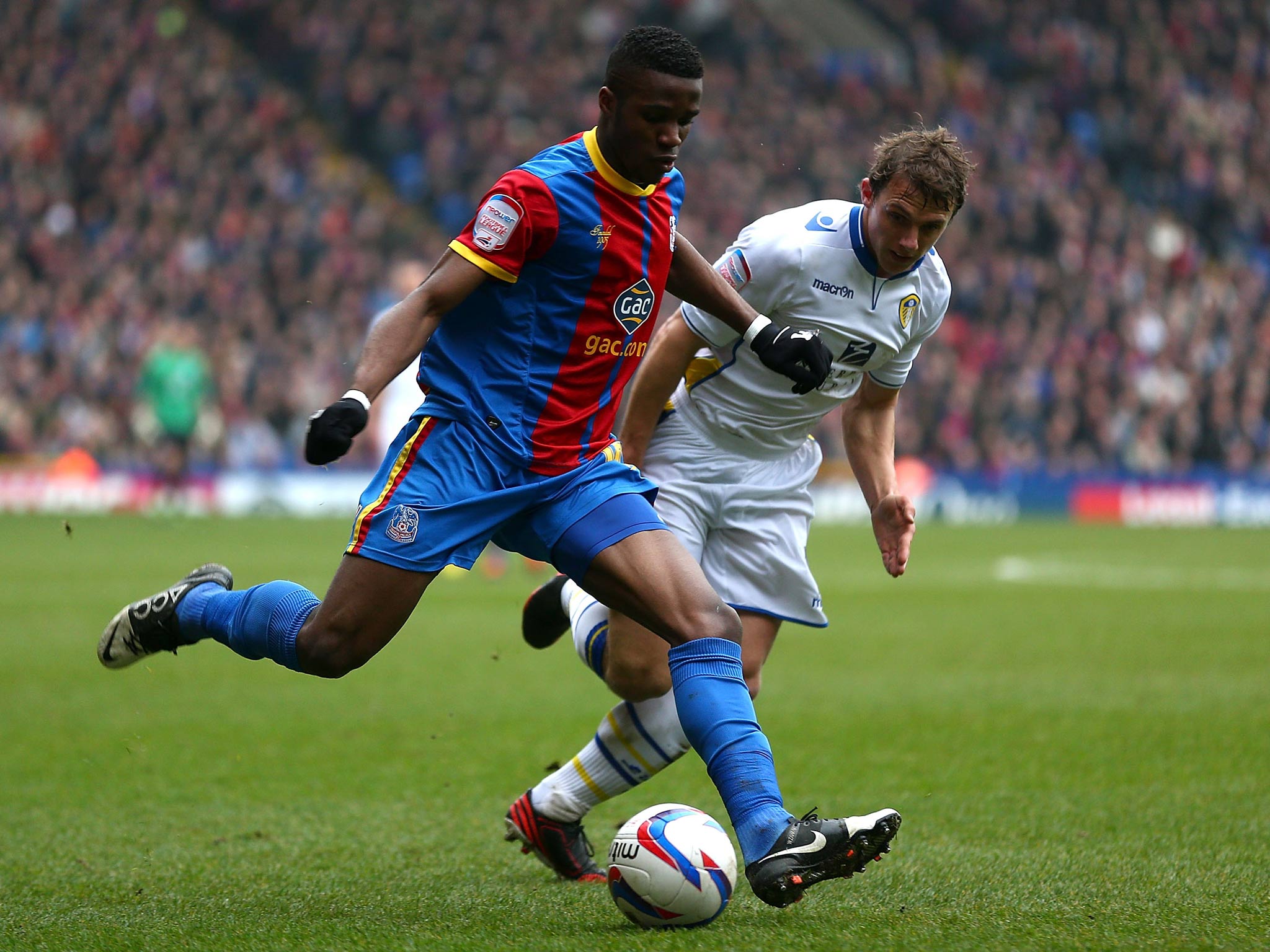 Wilfried Zaha in action against Leeds