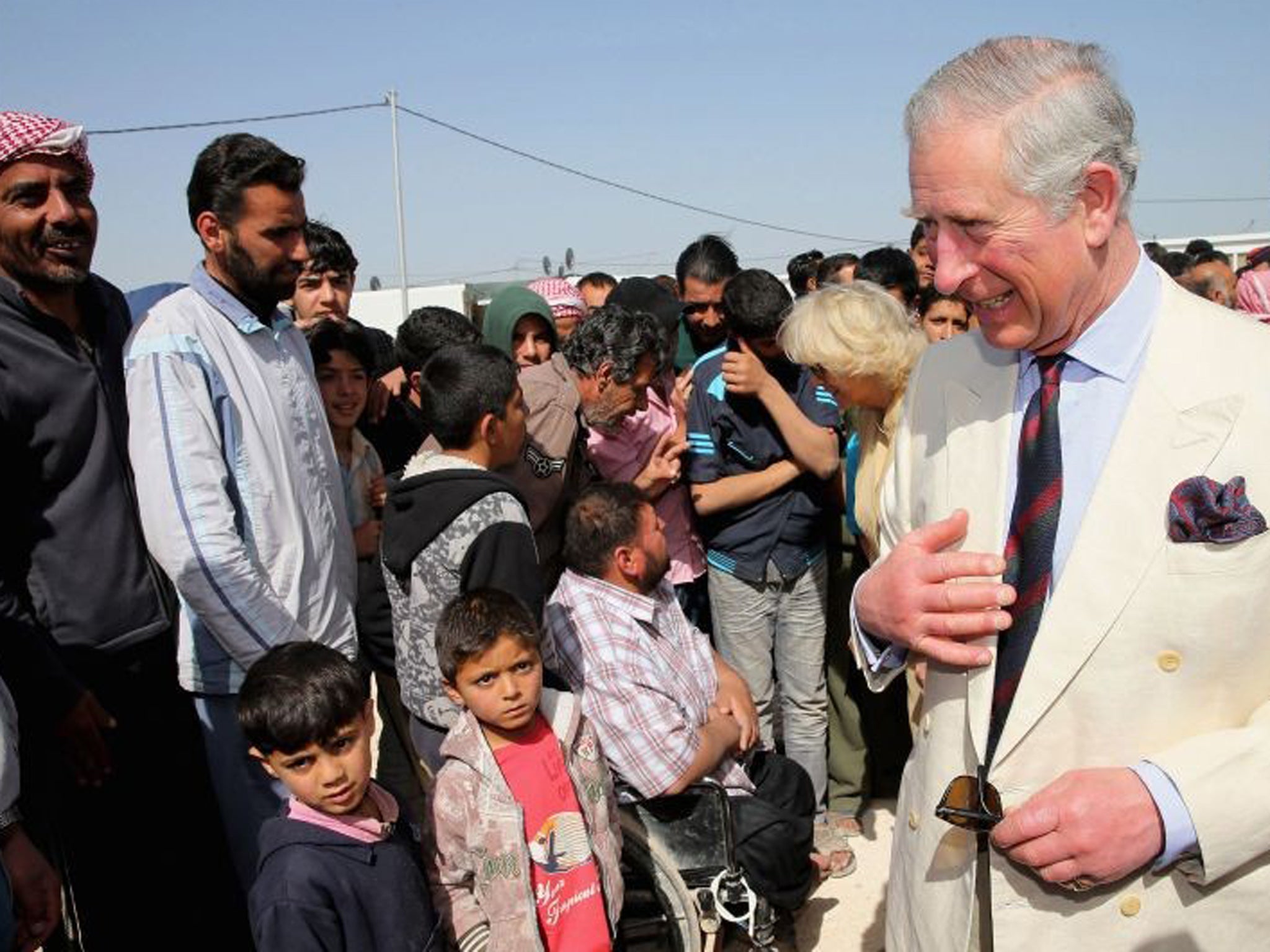 The Prince of Wales meets Syrian Refugees in the King Abdullah Refugee Camp on the Syrian border during his tour of Jordan