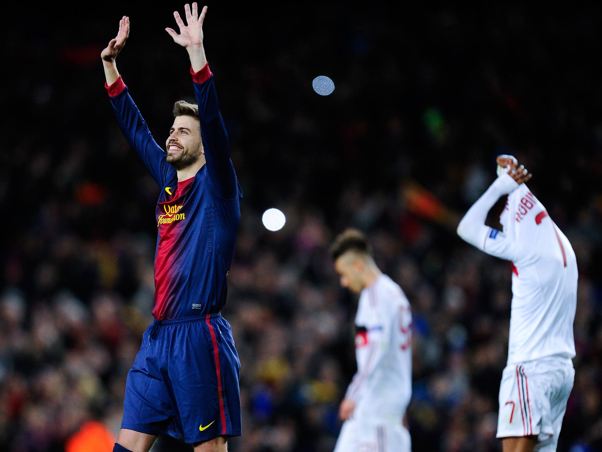 Gerard Pique of Barcelona celebrates at the end of his side's victory over AC Milan