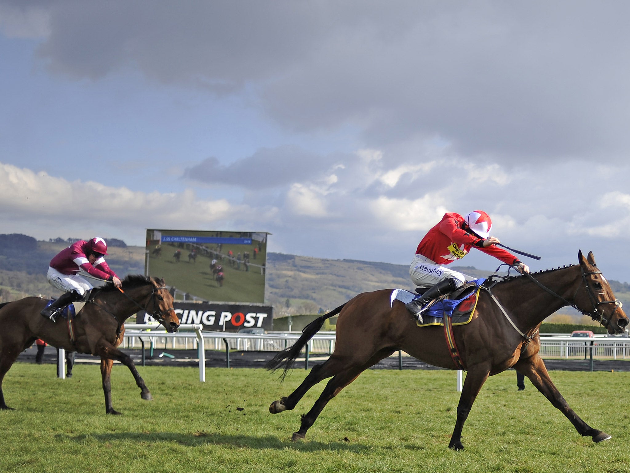 Sam Twiston-Davies rides The New One clear the last to win The Neptune Investment Management Novices' Hurdle Race