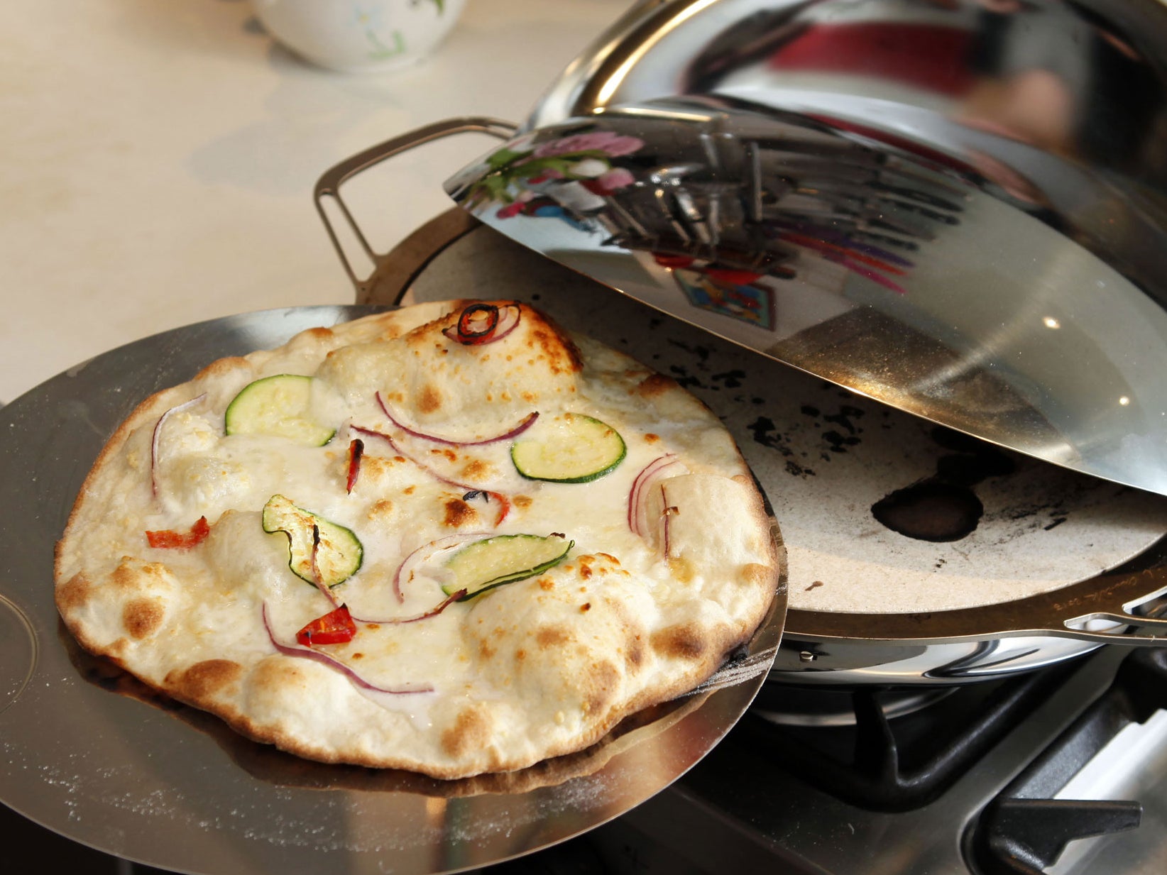 The finished pizza, which takes four minutes to cook