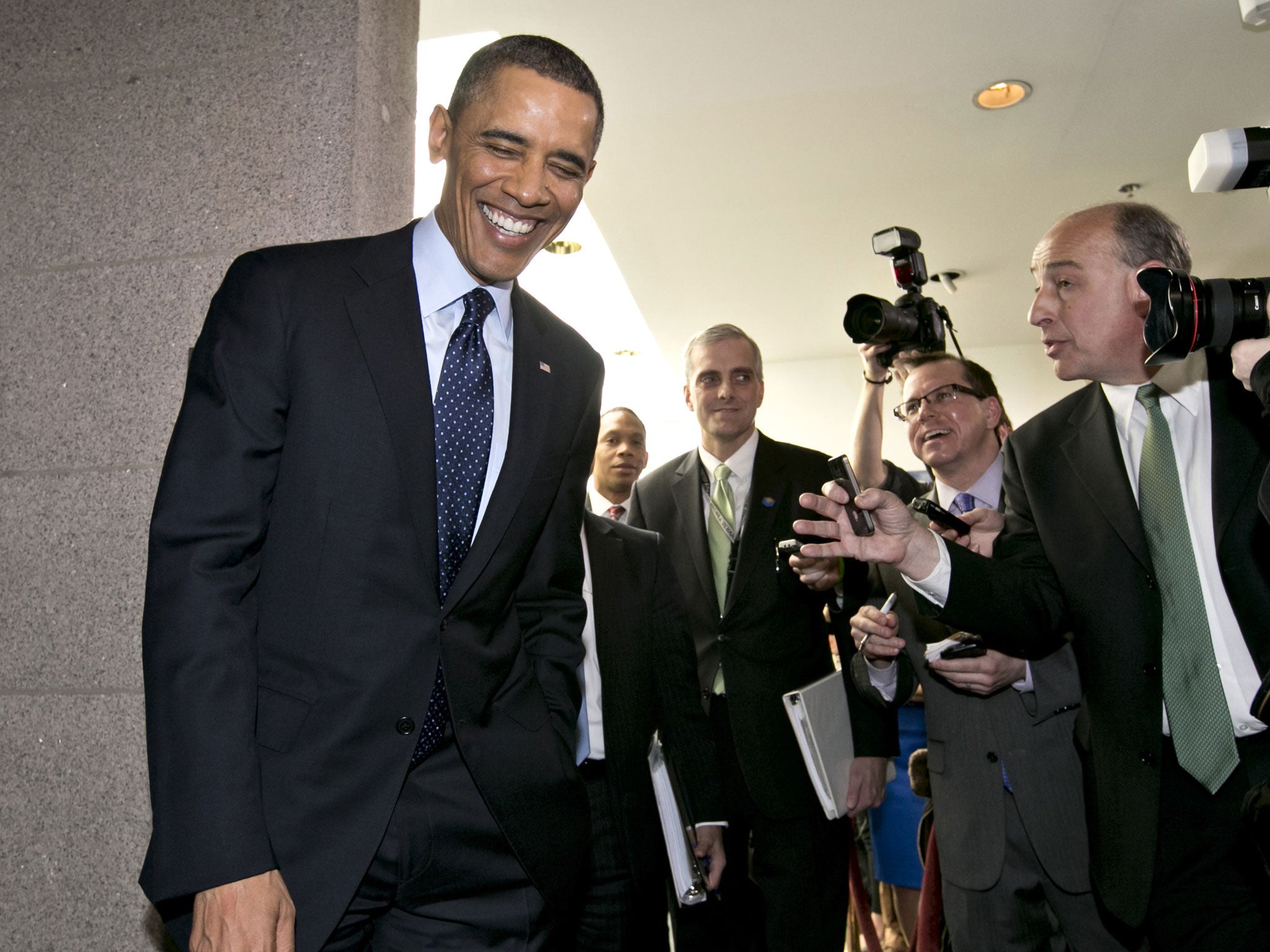 Barack Obama turns to reporters as he leaves the Capitol after his closed-door meeting with Speaker of the House John Boehner and Republican politicians