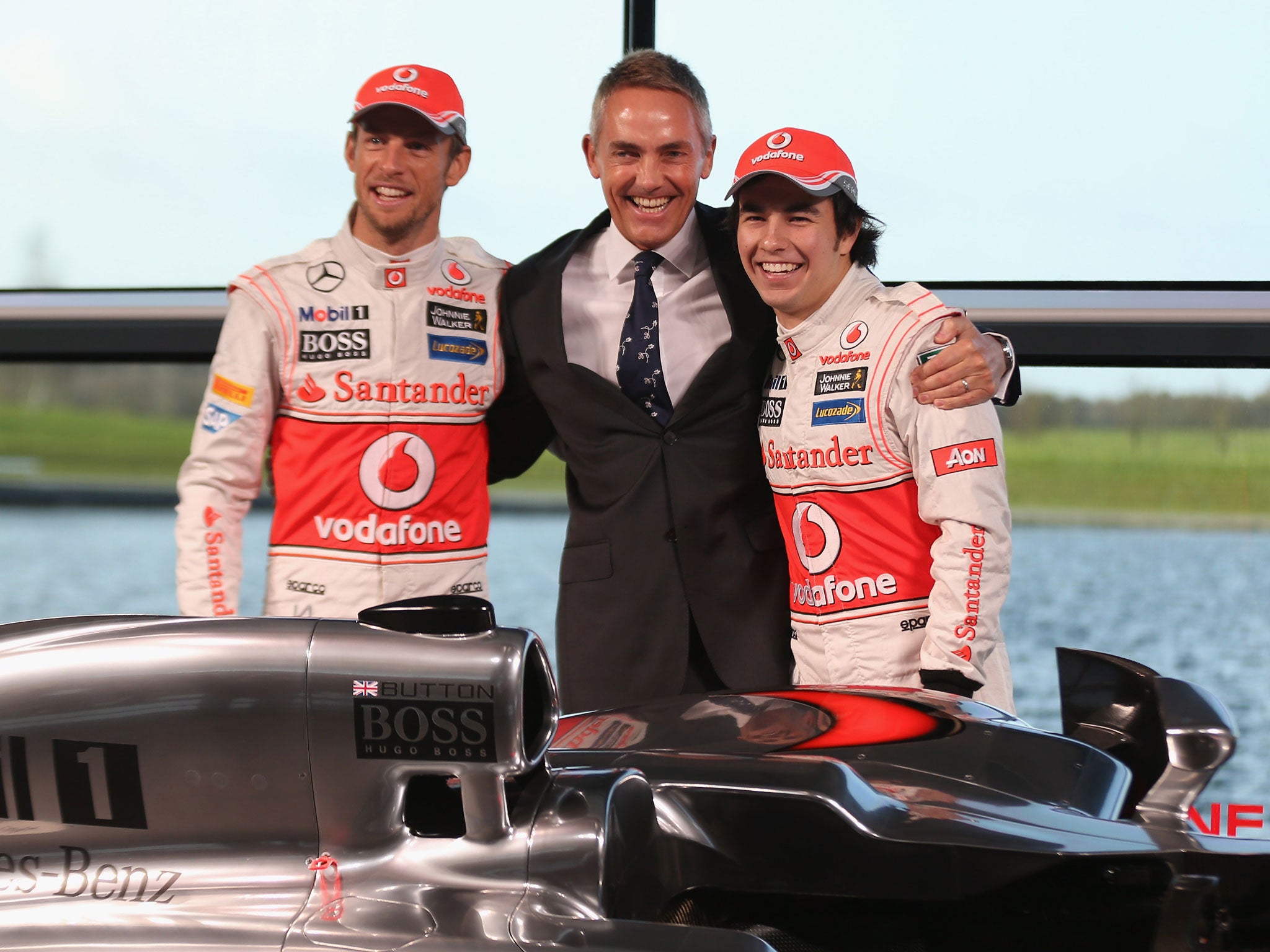 McLaren Mercedes Formula 1 drivers Jenson Button (L) of Great Britain and Sergio Perez (R) of Mexico