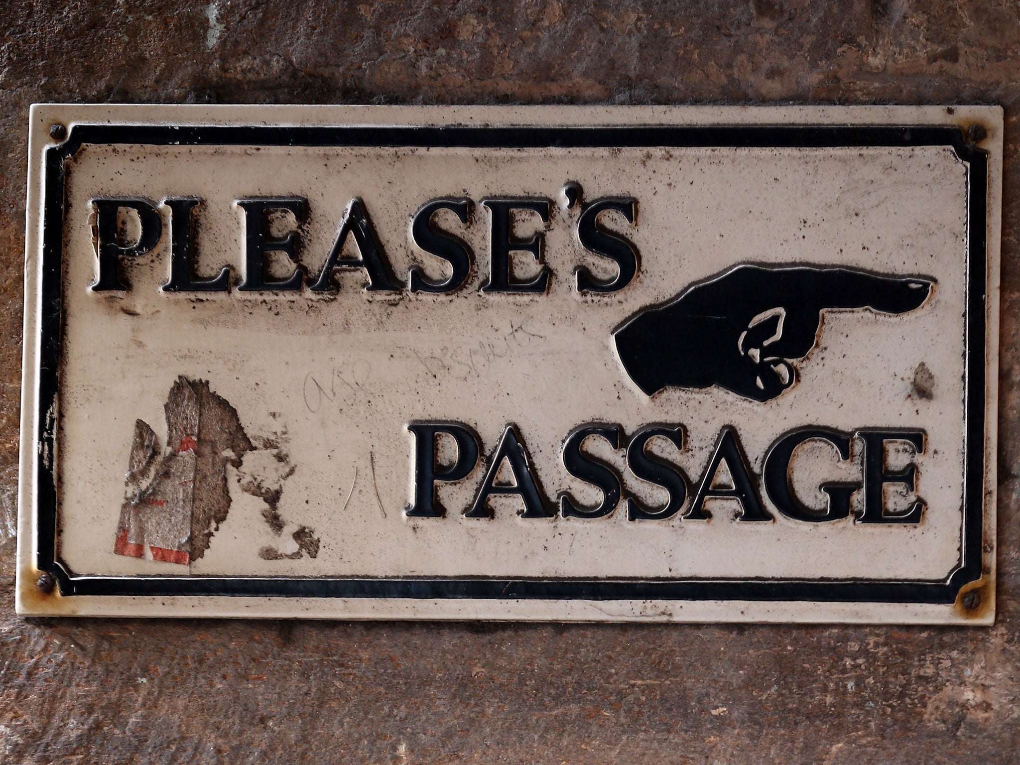 A sign points to more shops situated just of the main shopping street of Devon town Totnes on January 8, 2013 in Totnes, England.