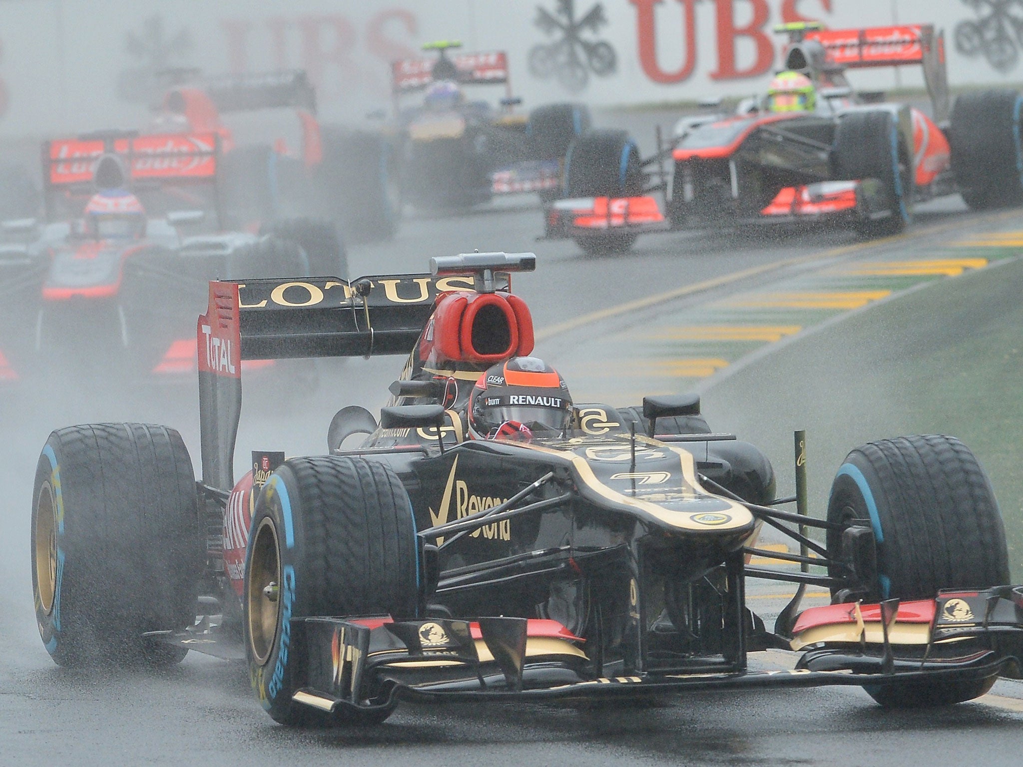 Pour conditions: Kimi Raikkonen leads the pack