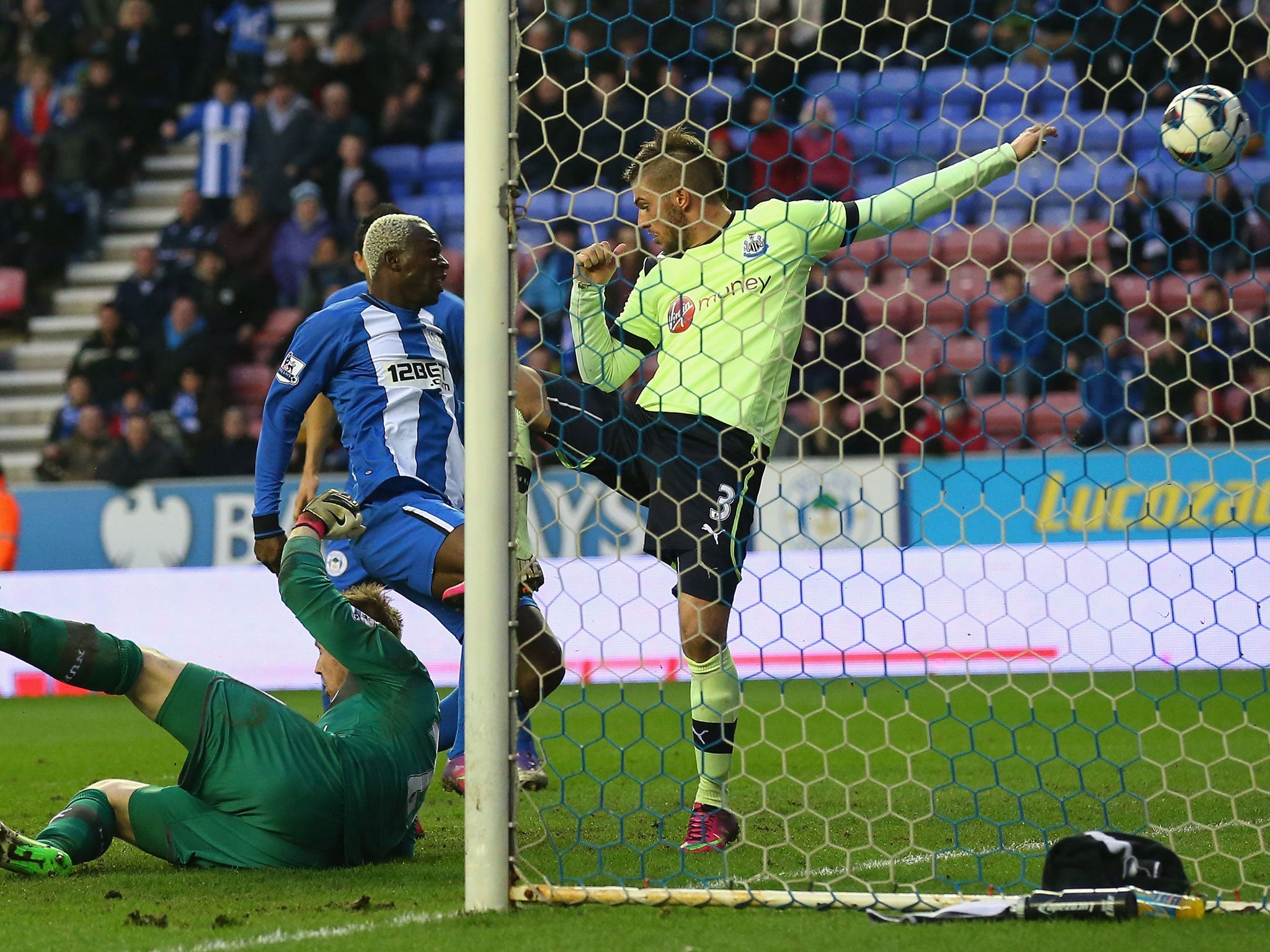 Arouna Kone of Wigan Athletic scores the winning goal