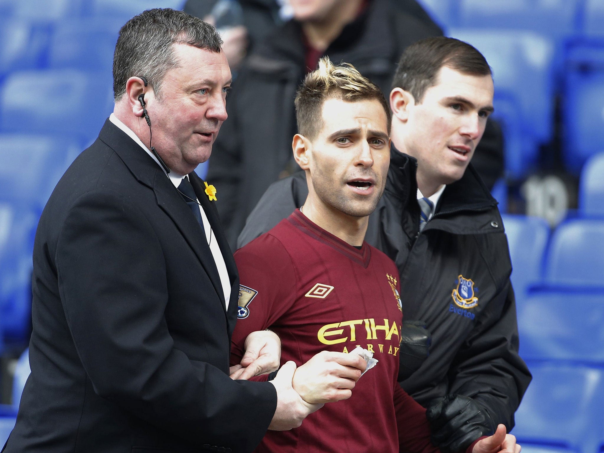 Jason Bent, Simon Brodkin's spoof footballer, being taken off the pitch