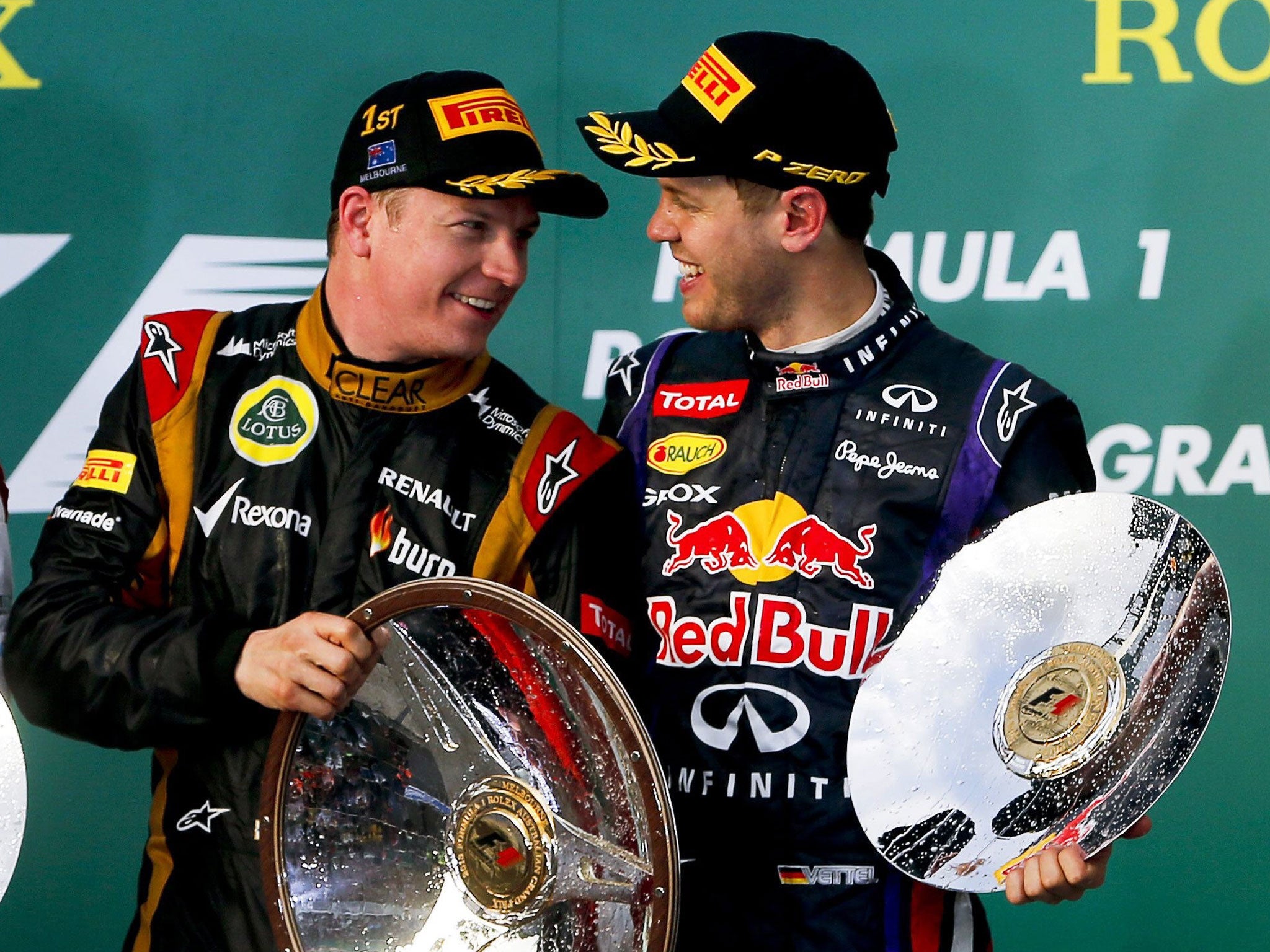 Kimi Raikkonen (left) chats to Sebastian Vettel after winning the opening grand prix of the season in Melbourne yesterday