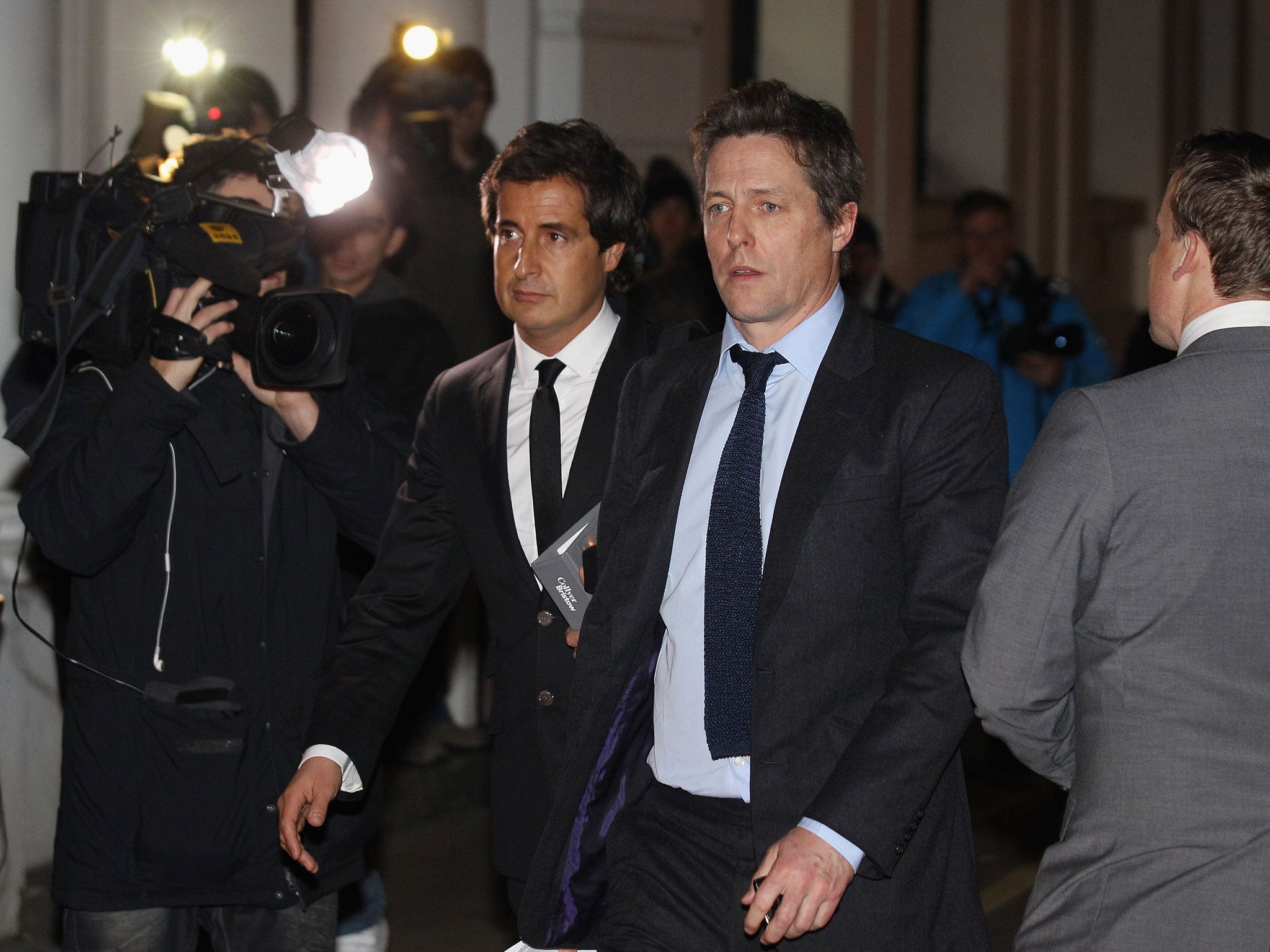 Actor Hugh Grant leaves after giving evidence to the Leveson Inquiry at The Royal Courts of Justice on November 21, 2011 in London, England.