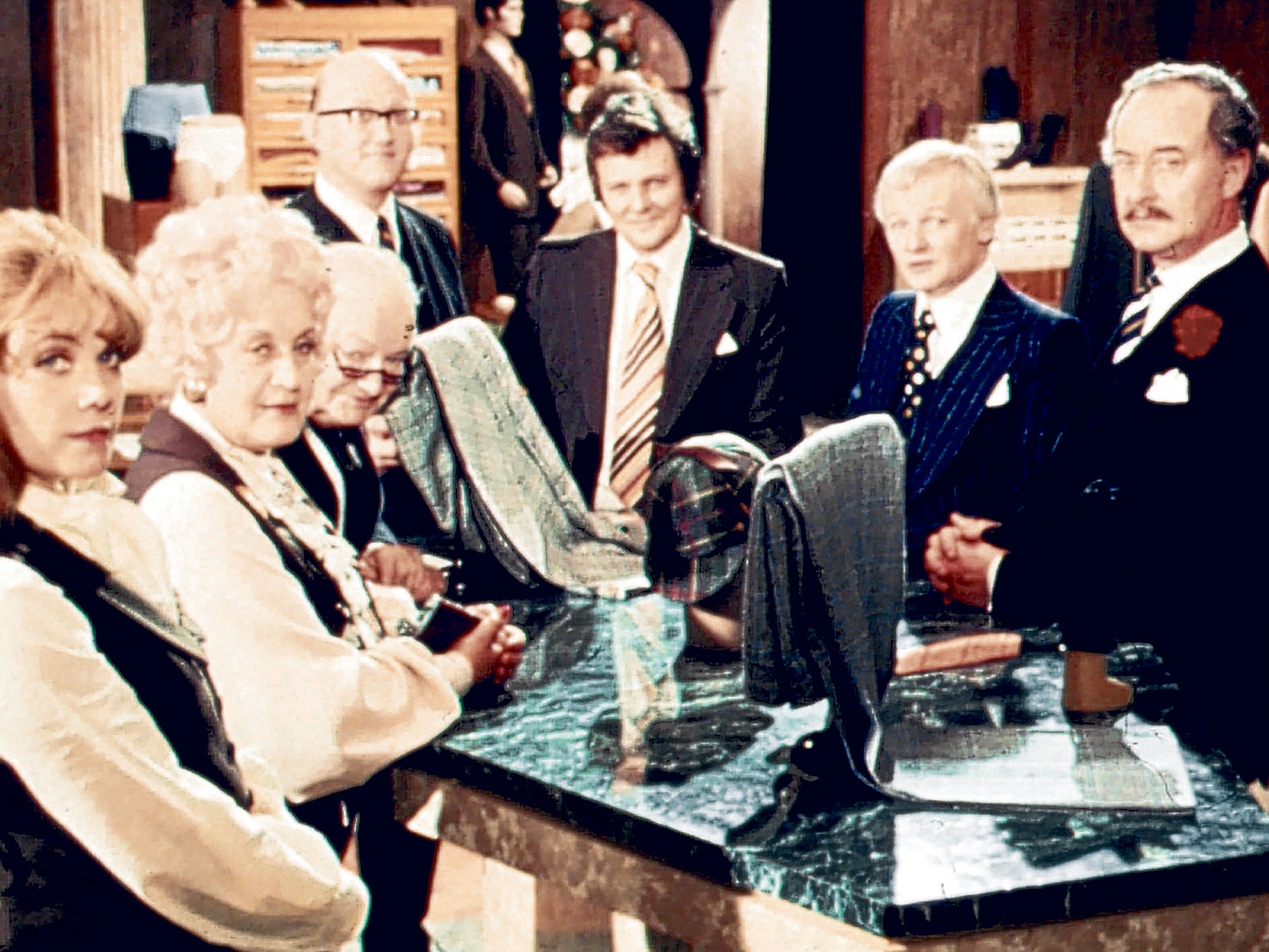 Thornton, far right, with the staff at Grace Brothers; although he was typecast as Captain Peacock, he never regretted taking the role