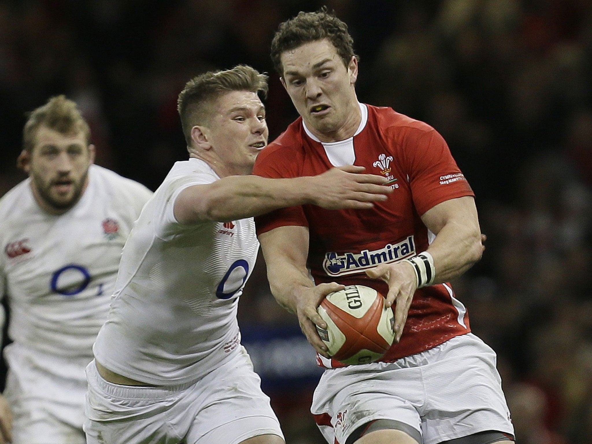 Owen Farrell struggles against Wales’ George North on Saturday