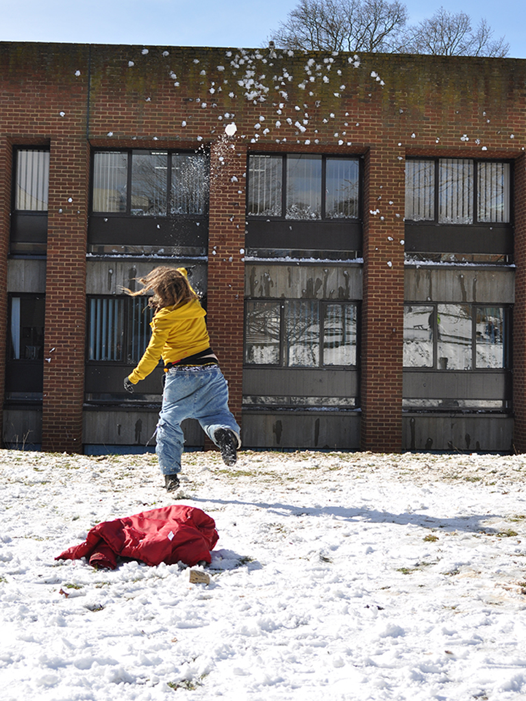 A Sussex University protester makes her voice heard in the snow