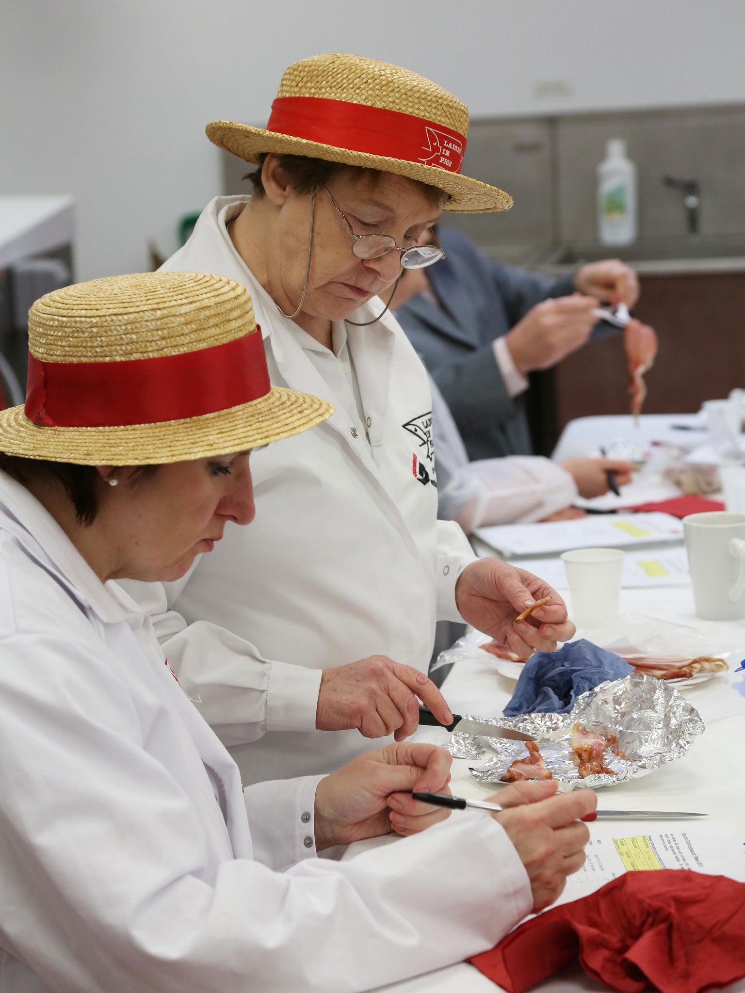 A nicer slice: Judges inspect the bacon at the Bacon Connoisseur Week Awards