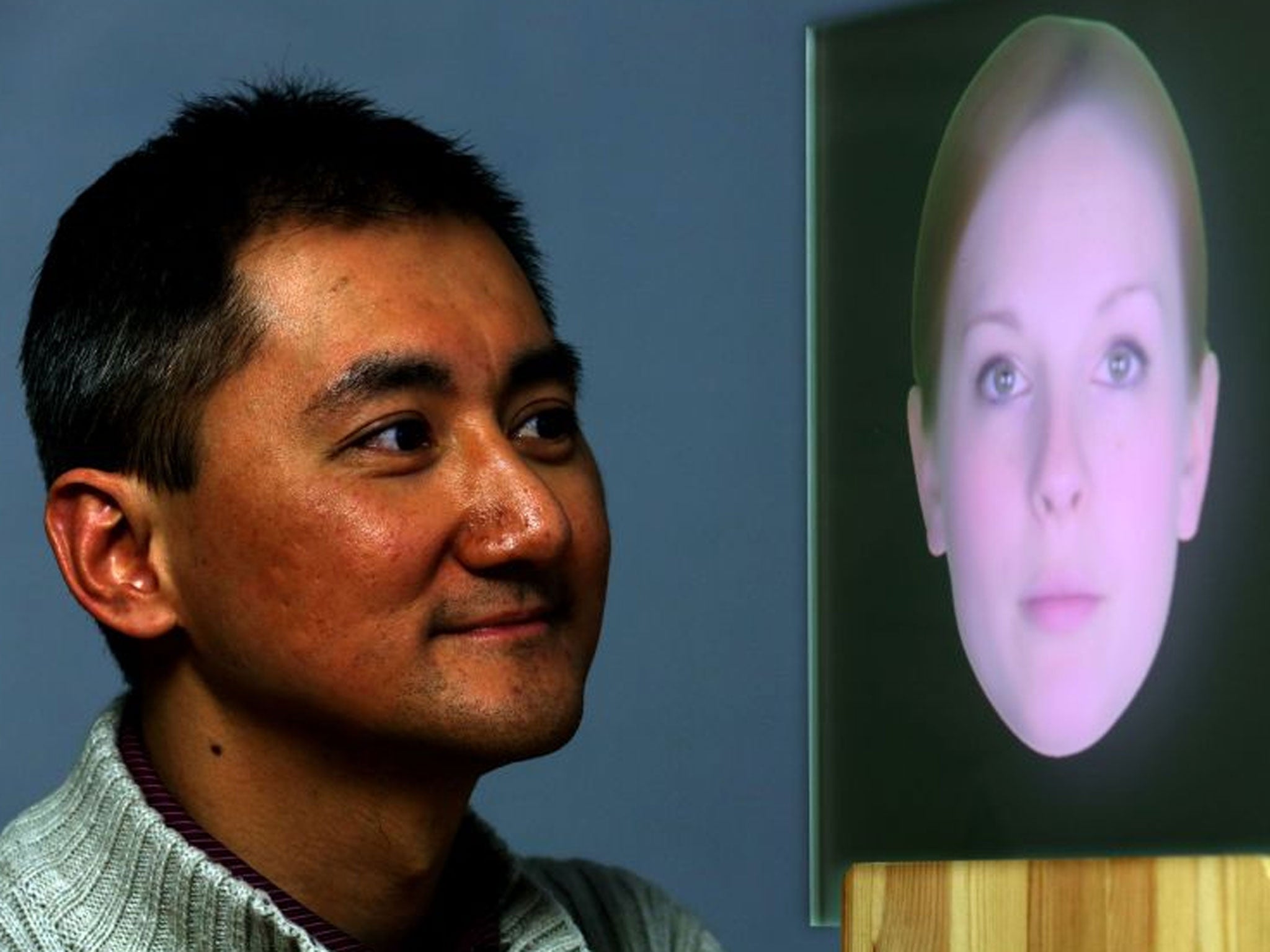 Research Engineer Dr Vincent Wan, from Toshiba Research in Cambridge, alongside digital talking head named Zoe by researchers