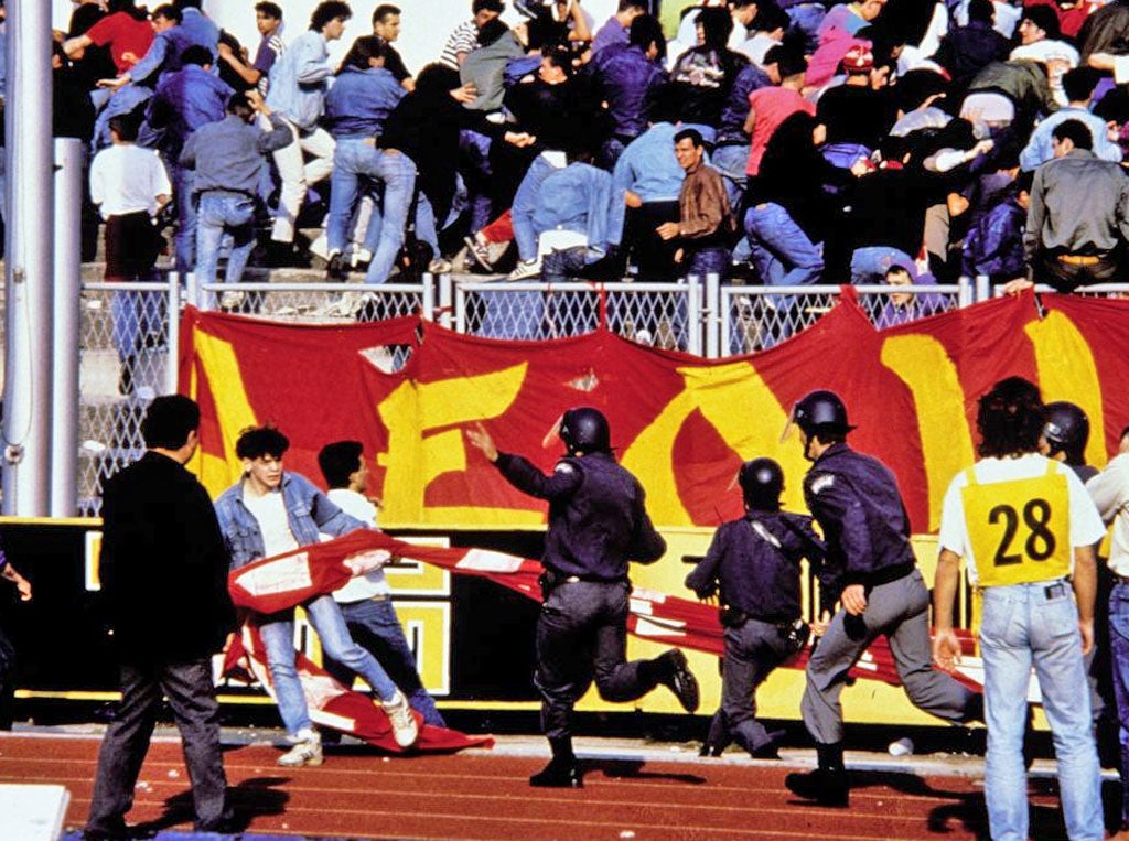 Police battle rioting fans when violence erupts at a football match between fans of Red Star Belgrade and Dynamo Zagreb Yugoslavia in 1990