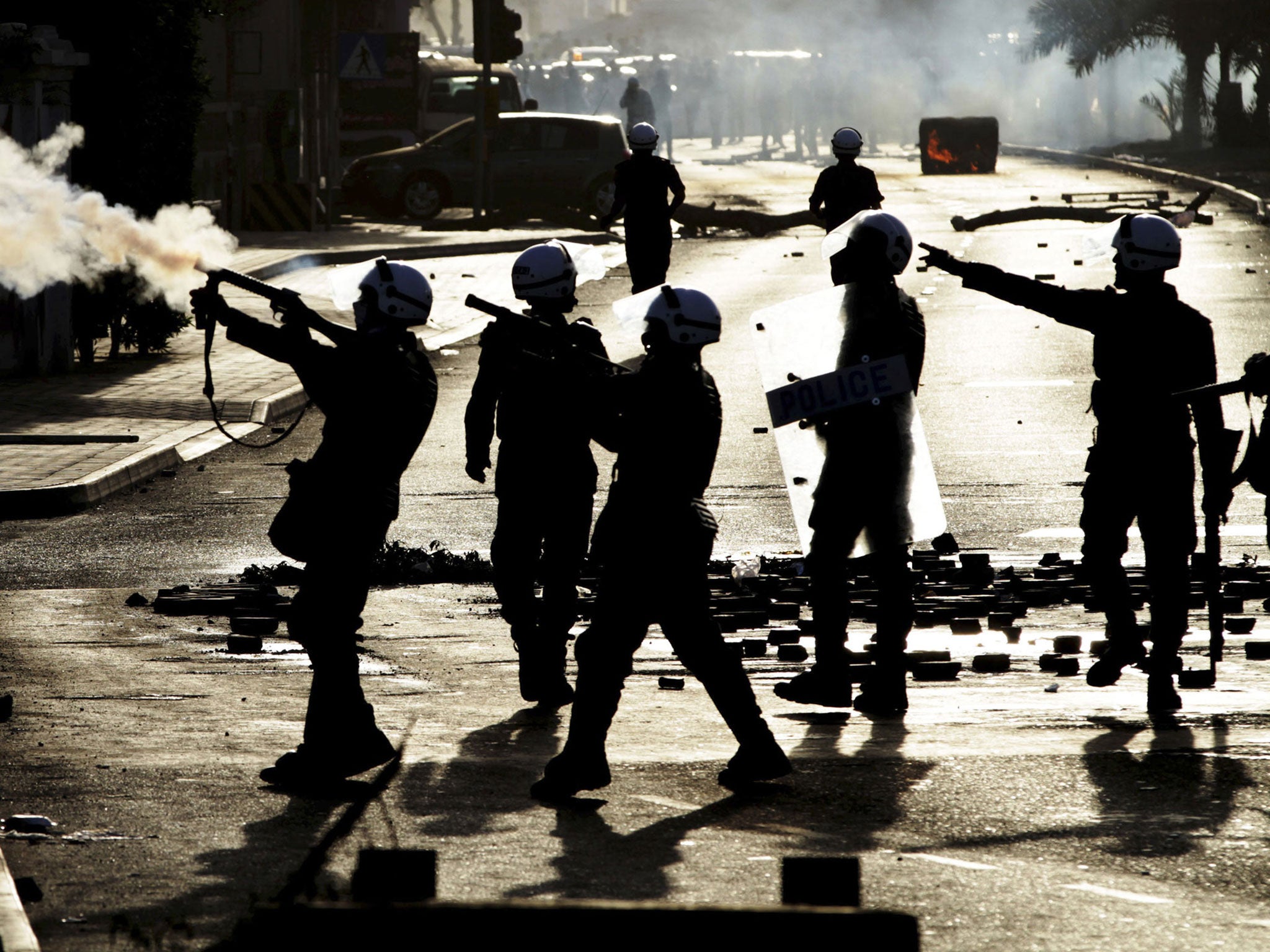 Riot police fire tear-gas at anti-government protesters earlier this month, after they had begun to gather at the site of the 2011 pro-democracy uprising