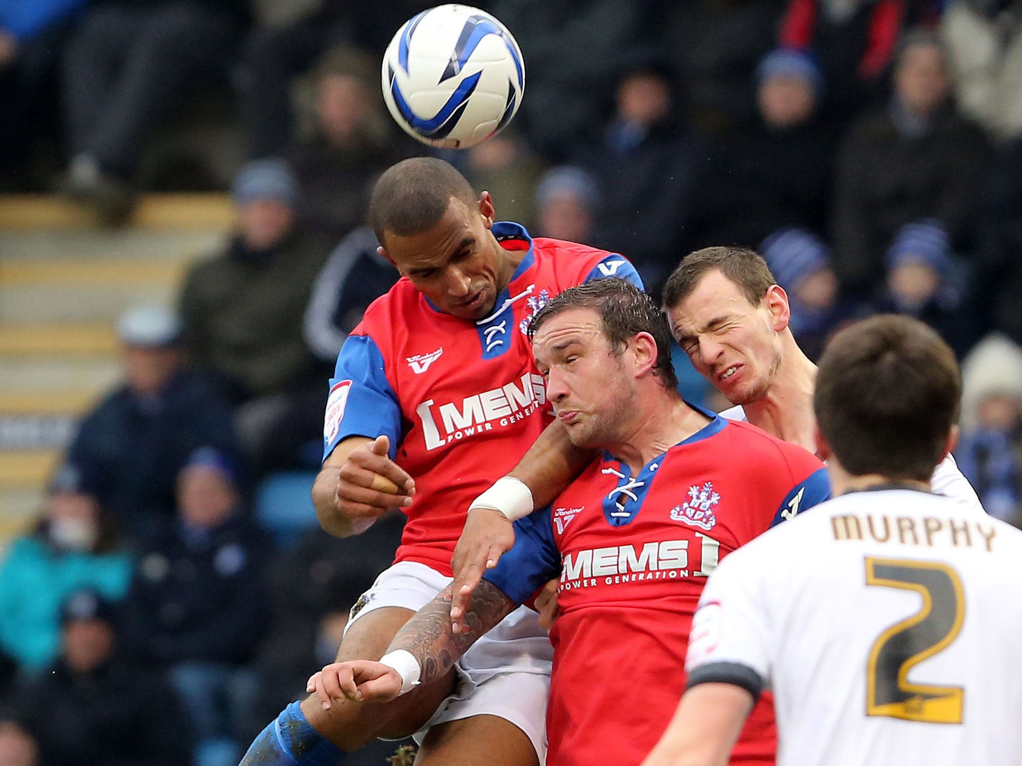 Gills’ Leon Legge wins a header