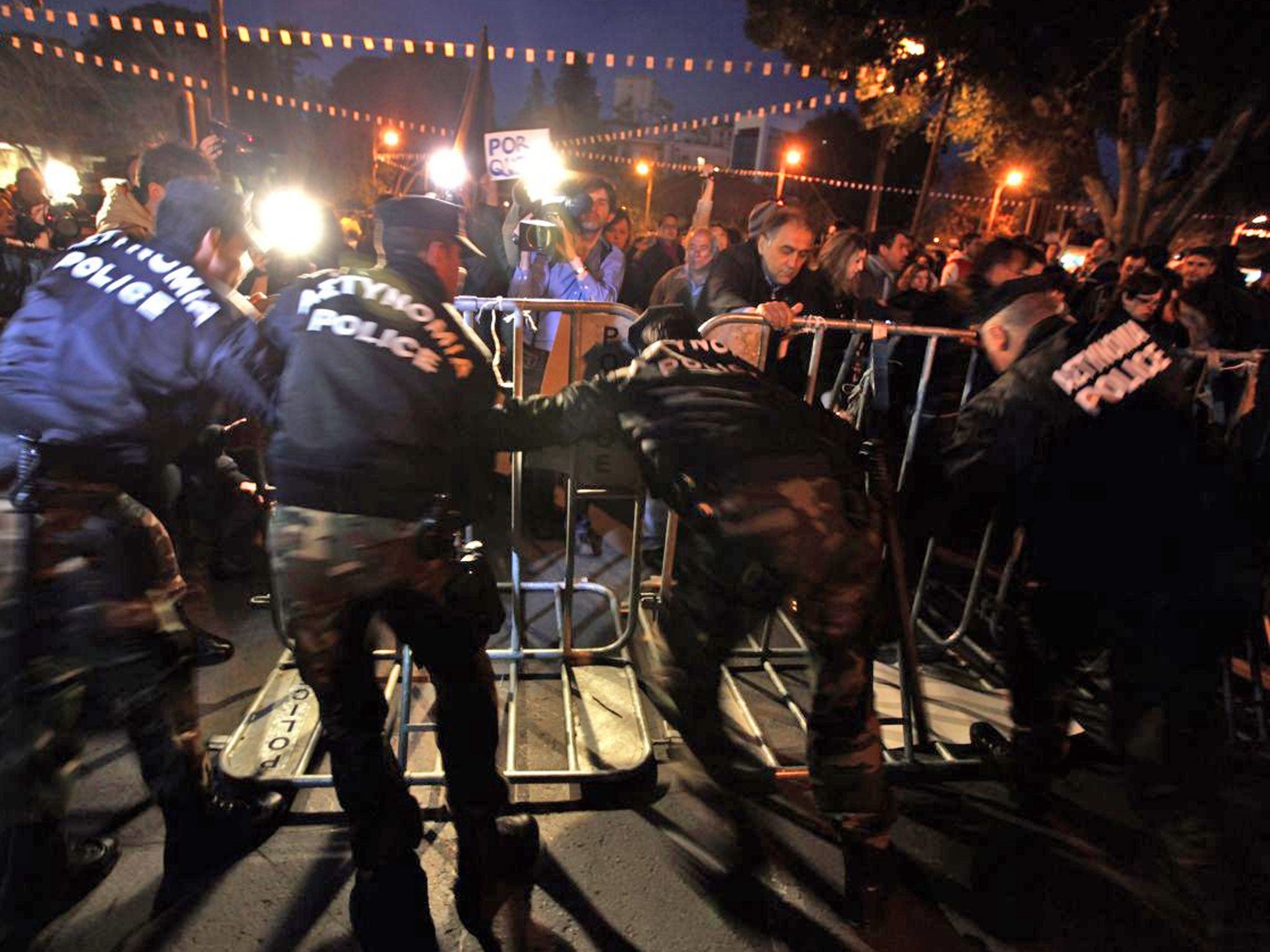 Police push back protesters outside Parliament