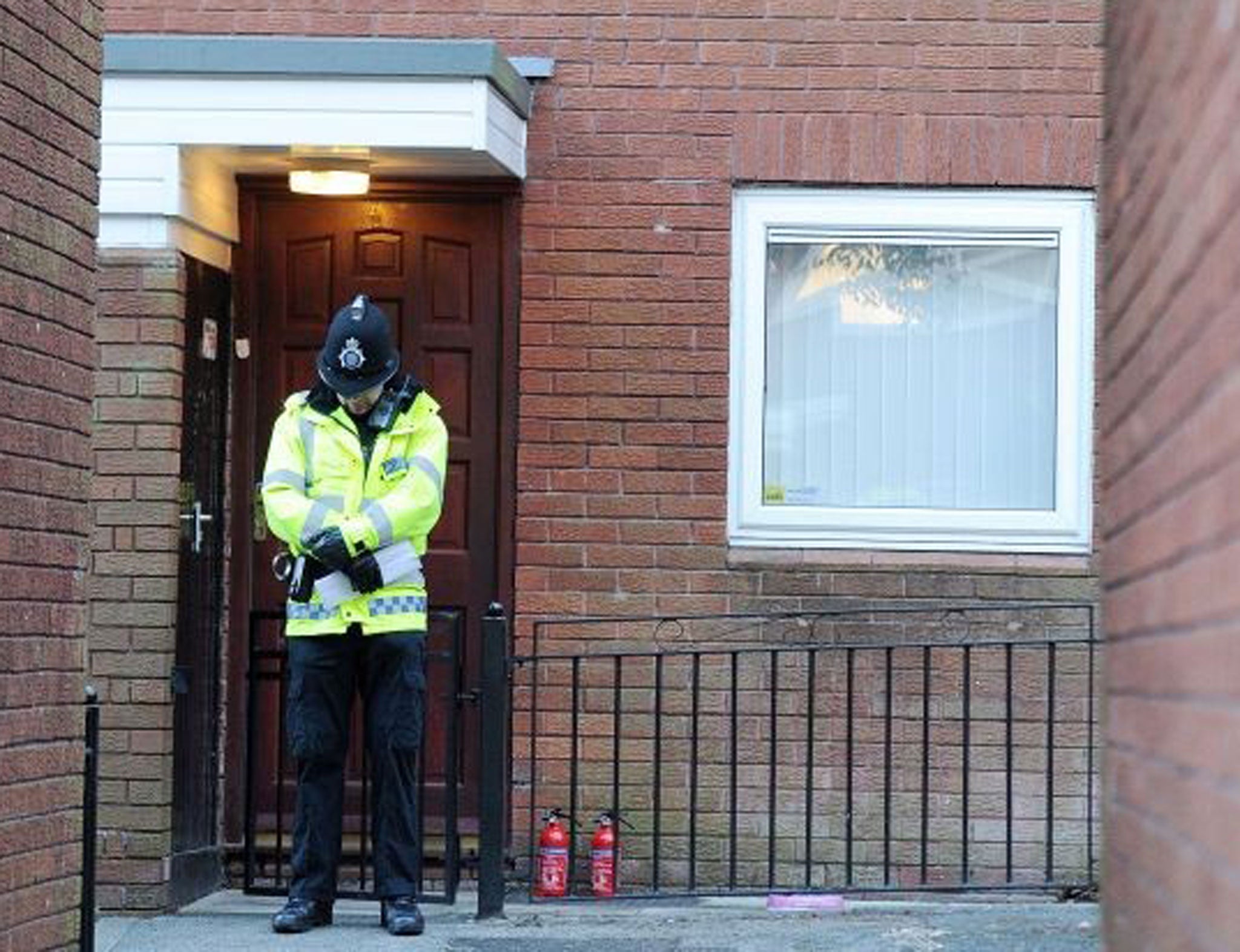 A police officer guards the house in Atherton where Jade Anderson was found dead