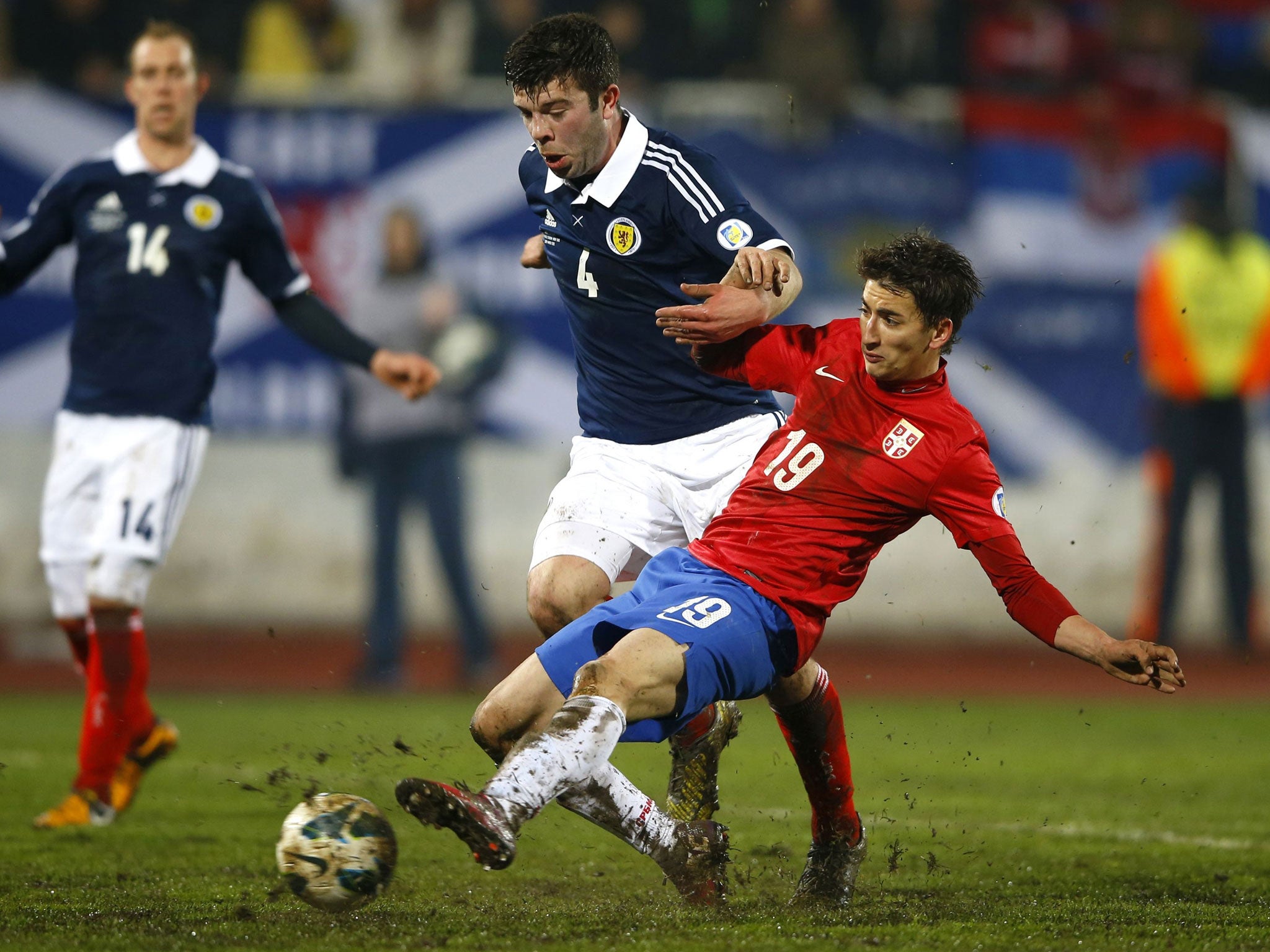 Serbia’s Filip Djuricic (right) challenges Scotland’s Grant Hanley