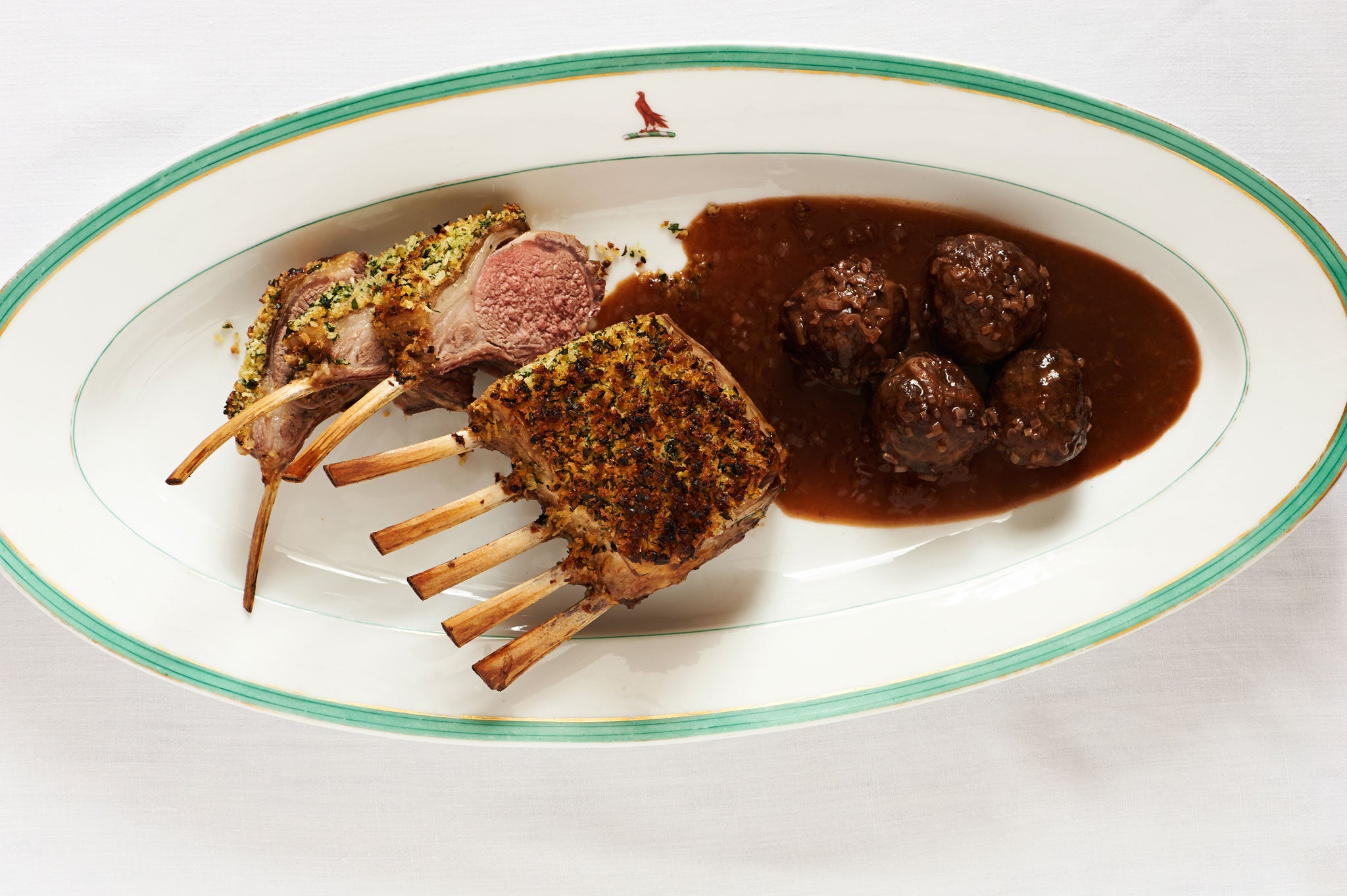 Herb-crusted rack of lamb with lamb faggots