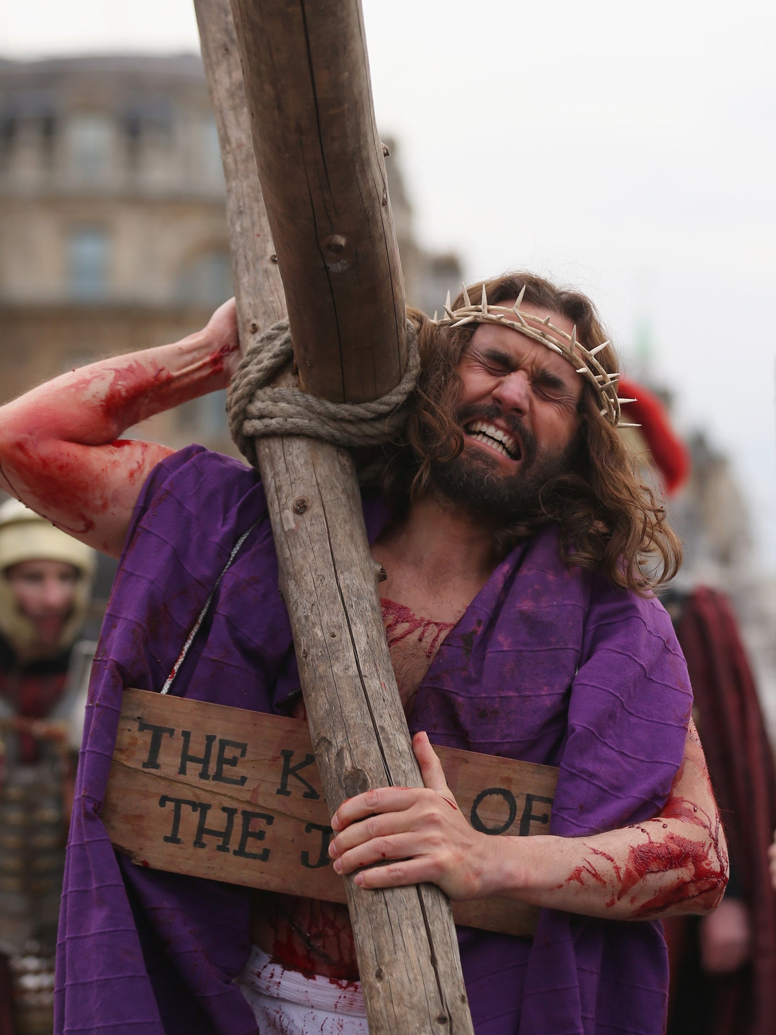 James Burke-Dunsmore carrying a cross