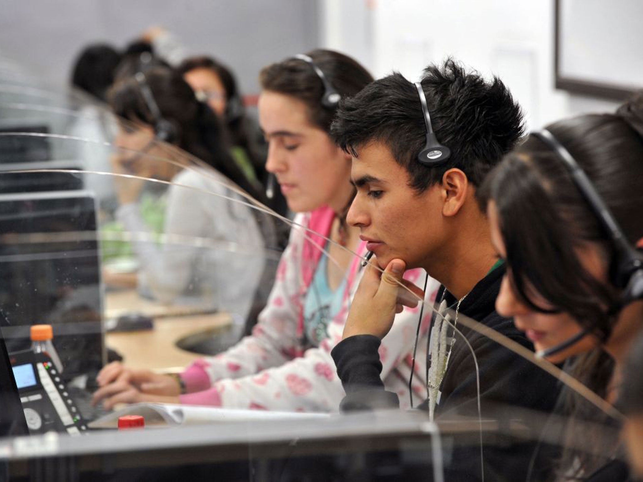 Young telemarketers work in a call center in Manizales, Caldas Department, Colombia