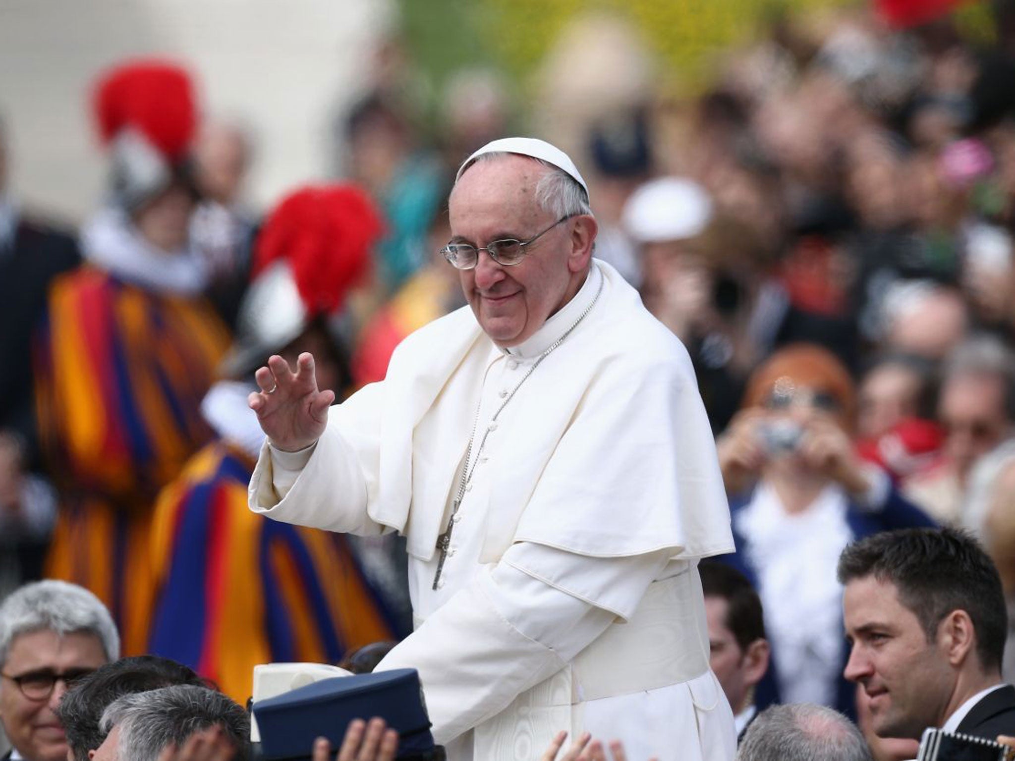 Tens of thousands of faithful had already filled the square hours before the Mass began in mid-morning