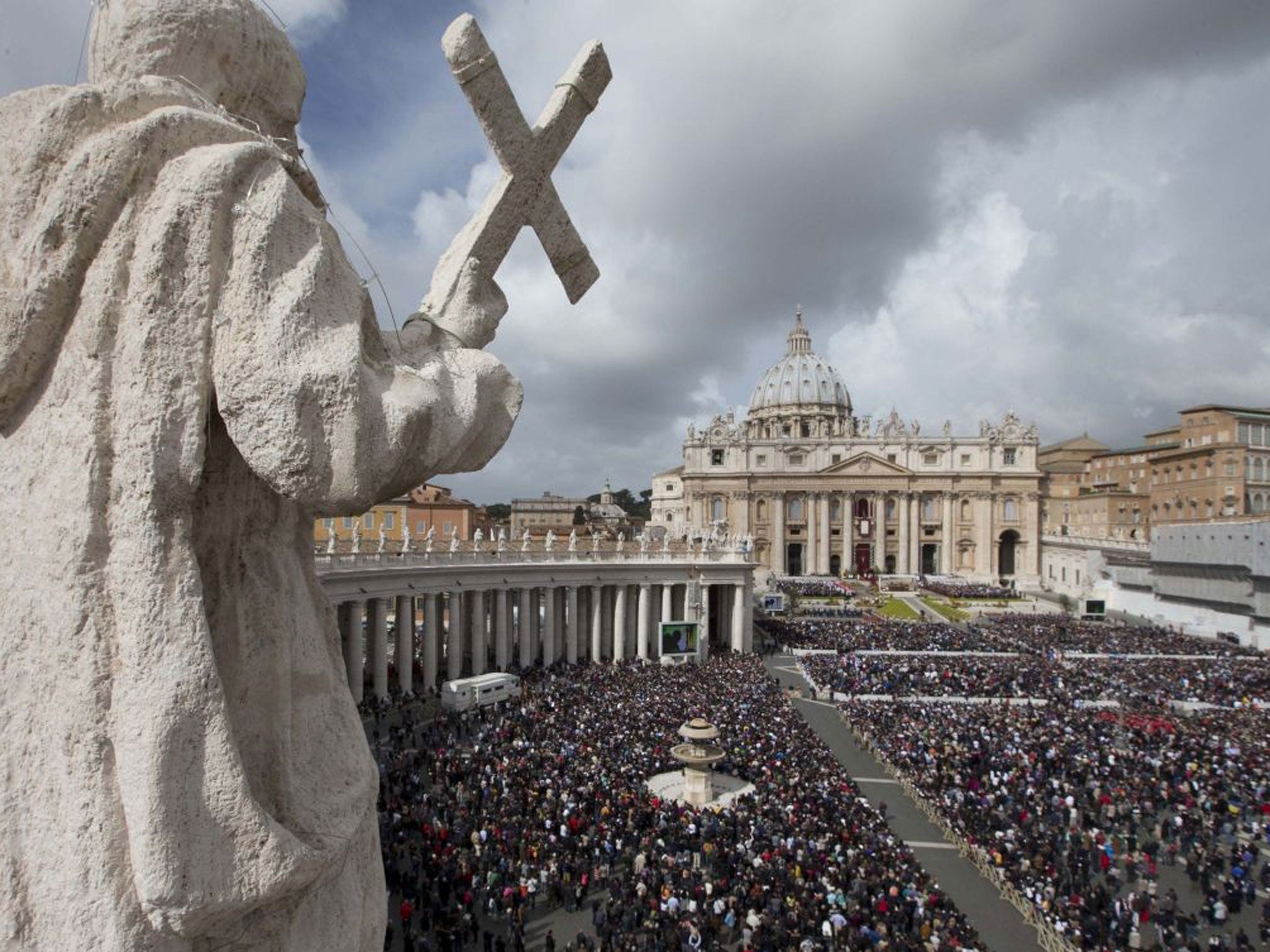 People crowd St. Peter's Square at the Vatican