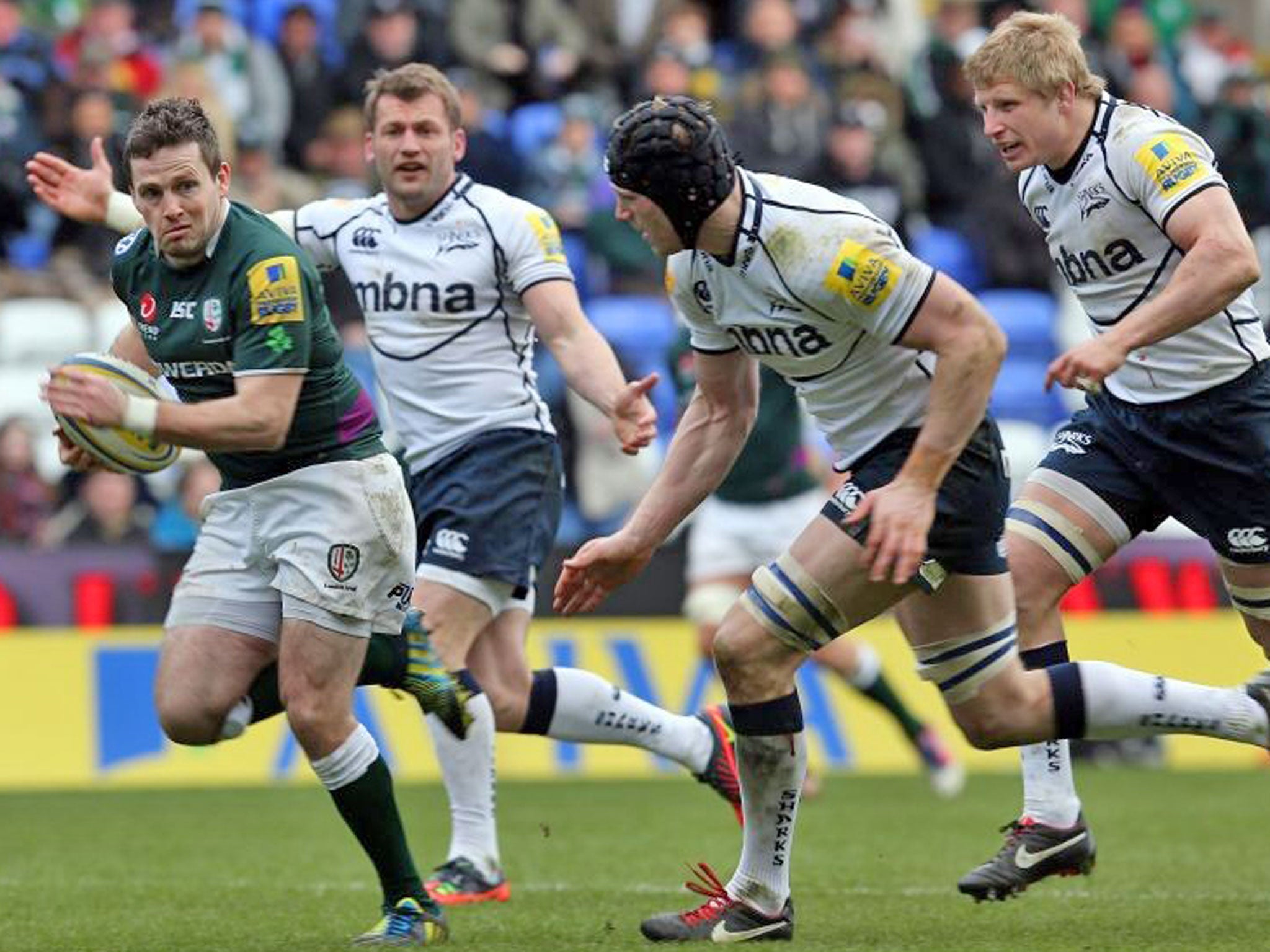 Kearnan Myall, of Sale, closes in on Irish scrum-half Darren Allinson