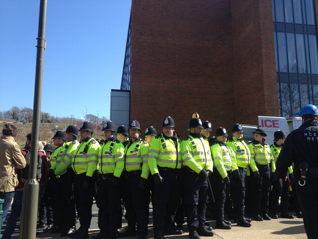 A line of police protects Bramber House