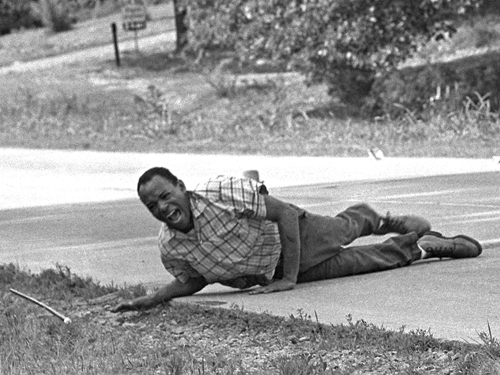 James Meredith pulls himself across Highway 51 in Hernando, Mississippi, after being shot on the second day of his march for voters’ rights in 1966