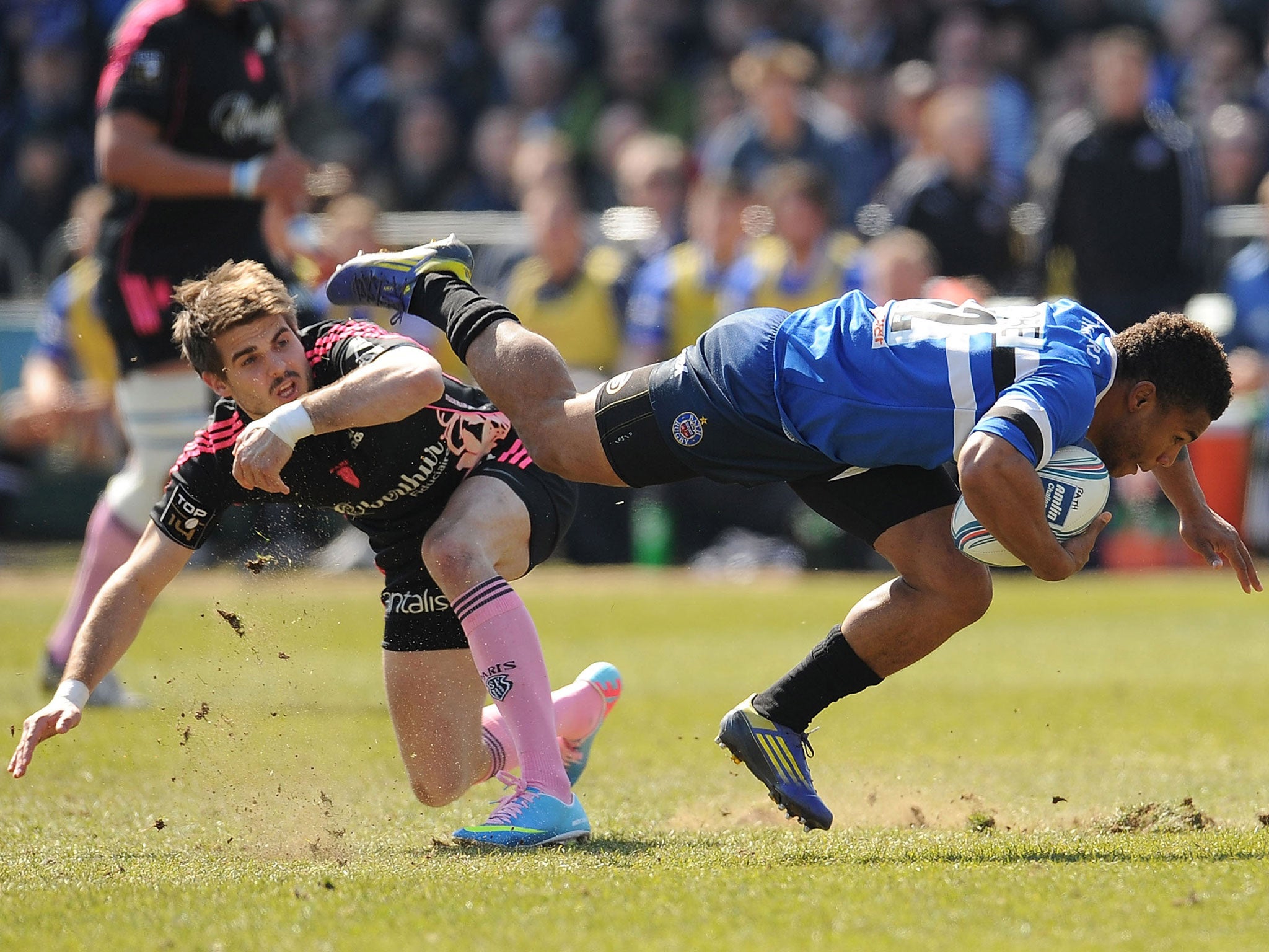 Over and out: Eastmond is tackled by Bonneval