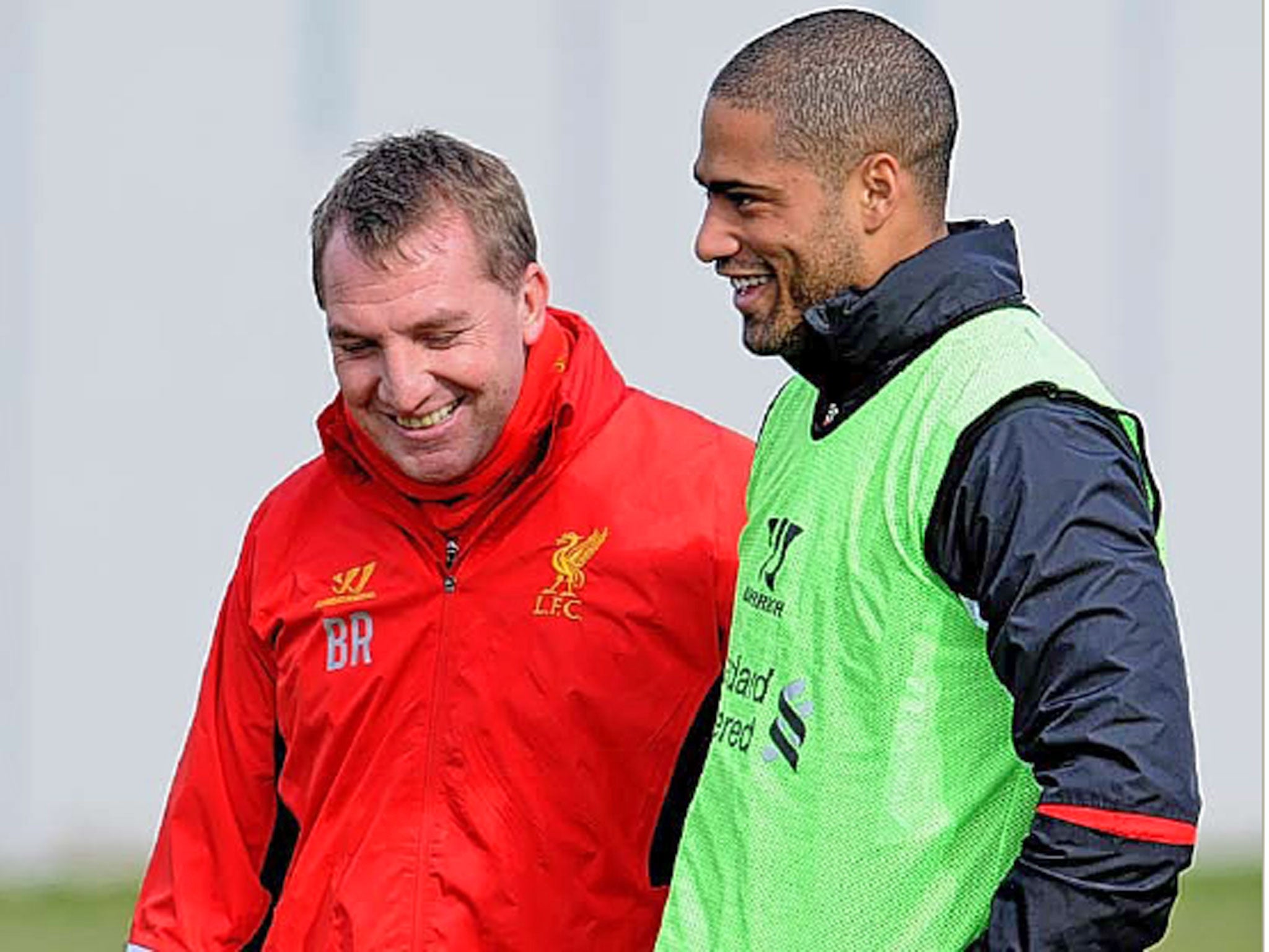 Glen Johnson shares a joke with Brendan Rodgers during training